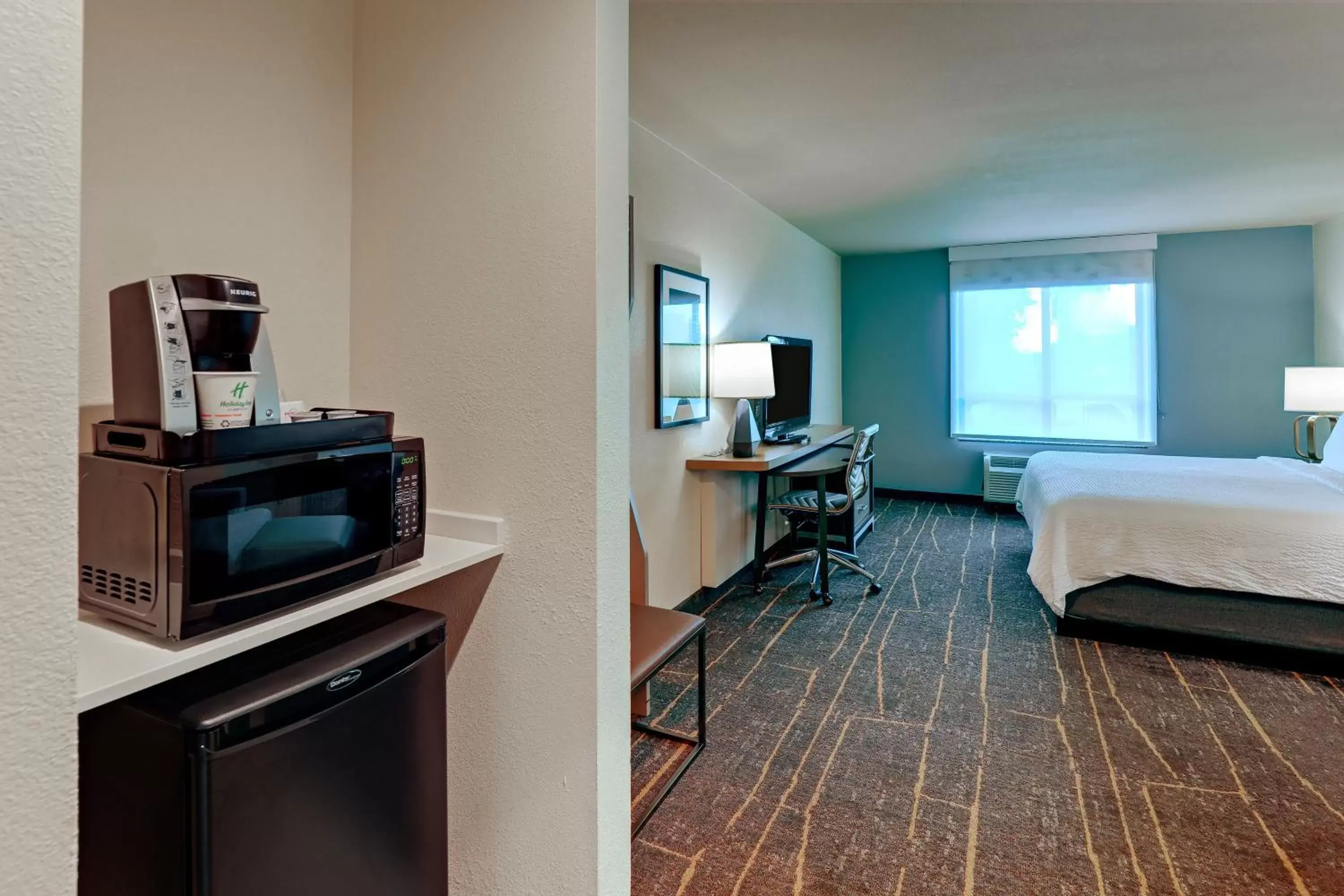 Photo of the whole room, TV/Entertainment Center in Holiday Inn Mobile Airport, an IHG Hotel