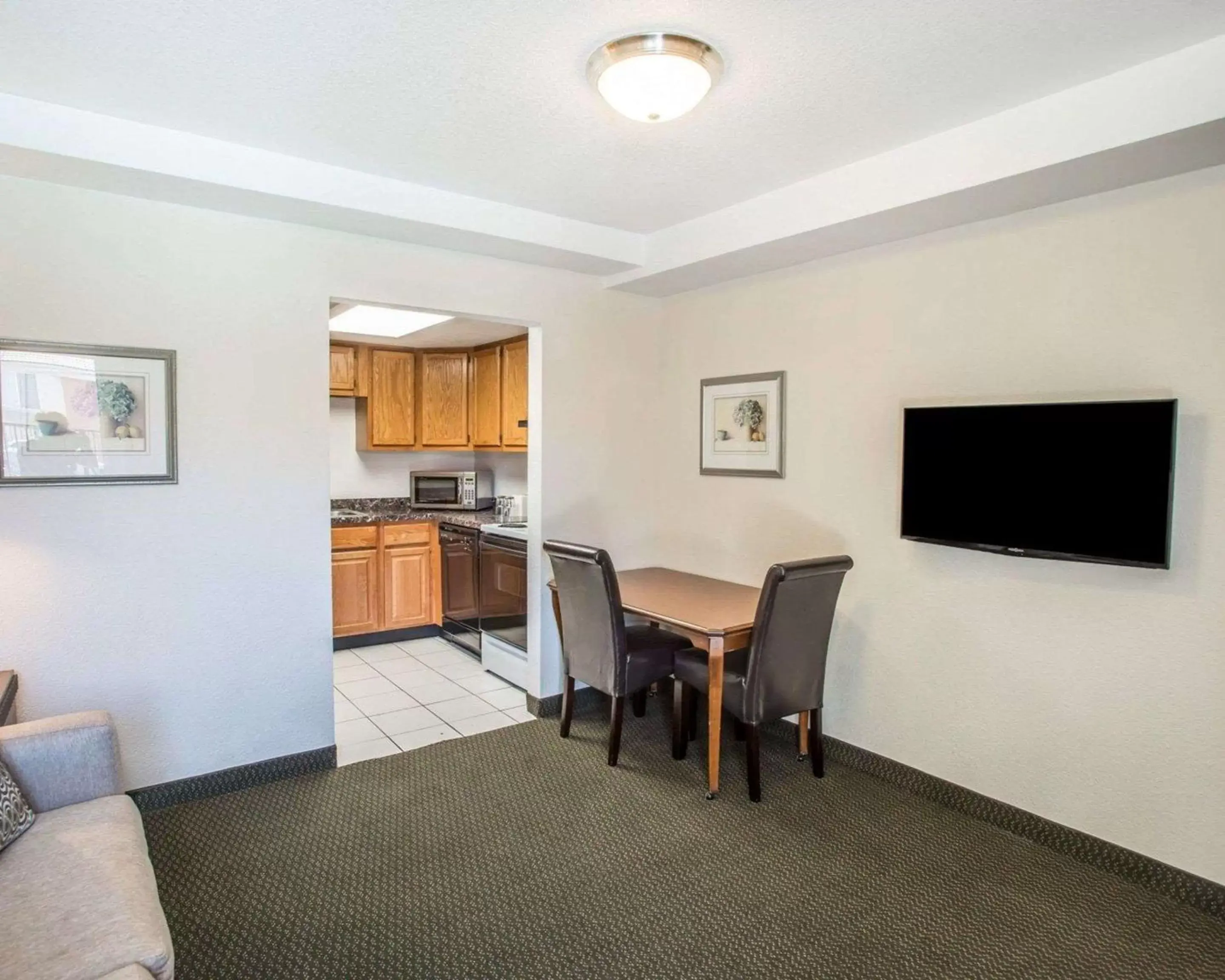 Photo of the whole room, TV/Entertainment Center in Rodeway Inn Greeley