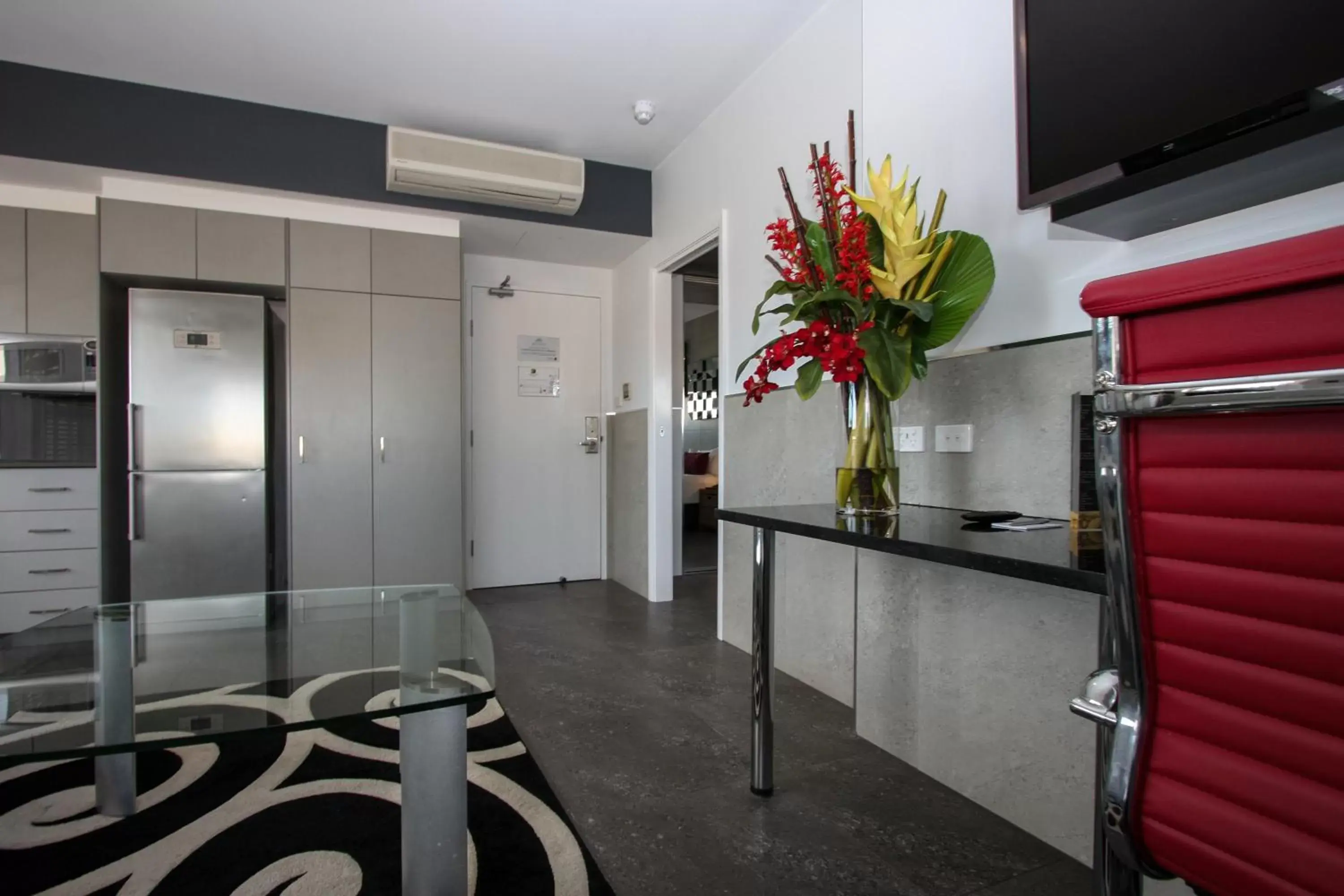 Living room, TV/Entertainment Center in Honeysuckle Executive Apartments