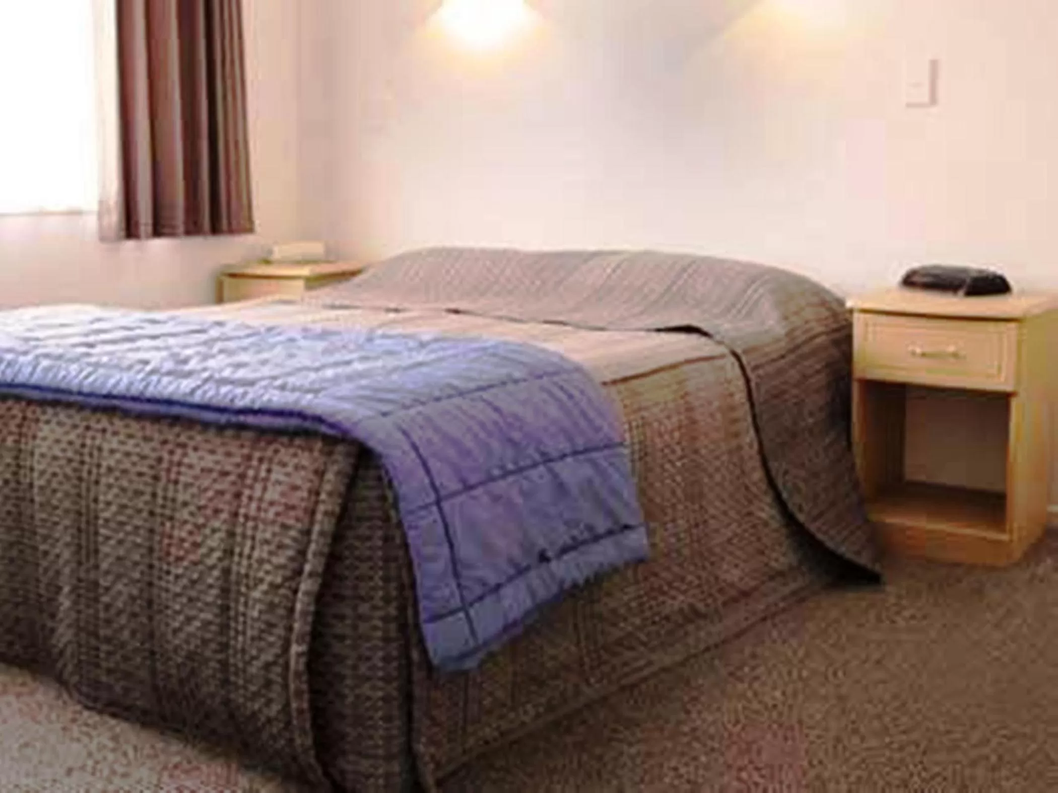 Bed in Riverview Motel