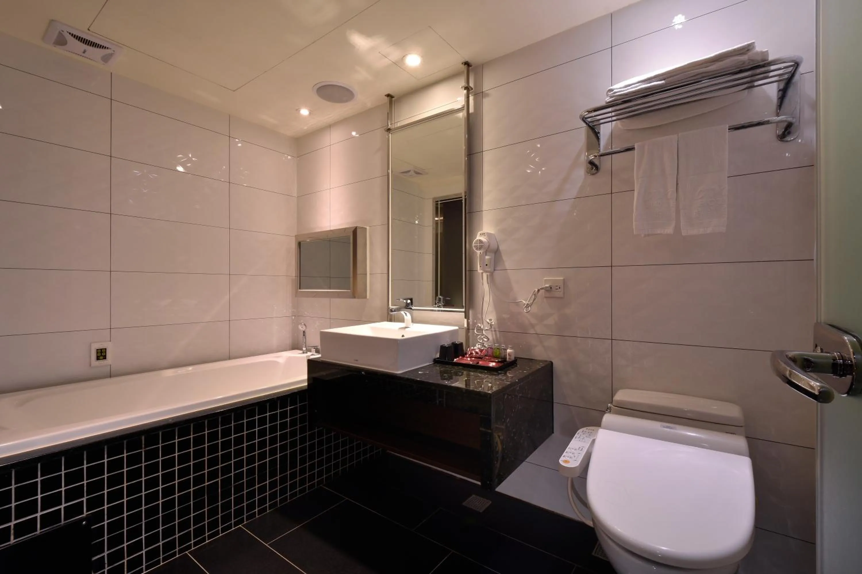 Bathroom in V-one Vogue Hotel