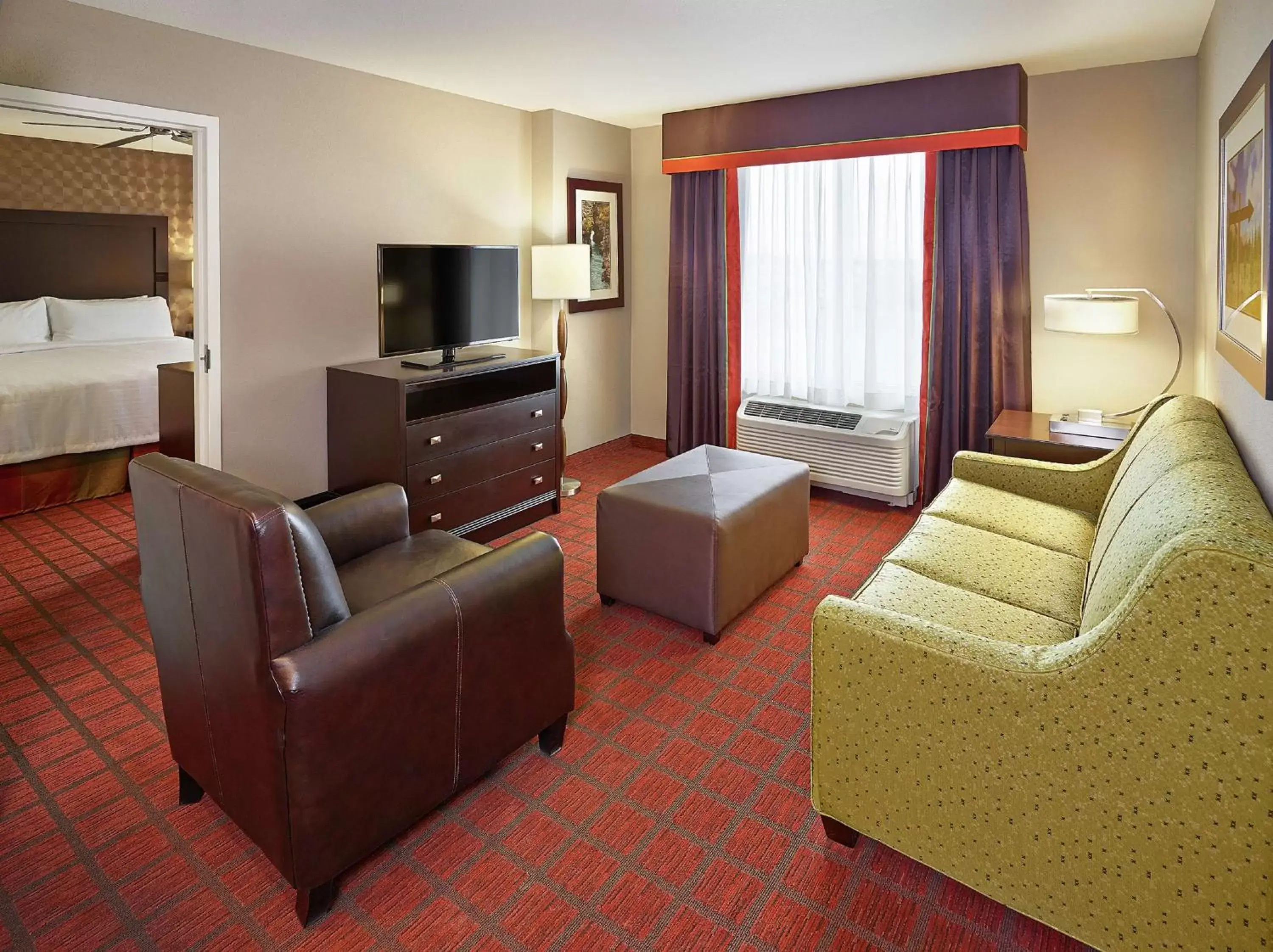 Bedroom, Seating Area in Homewood Suites Calgary Airport