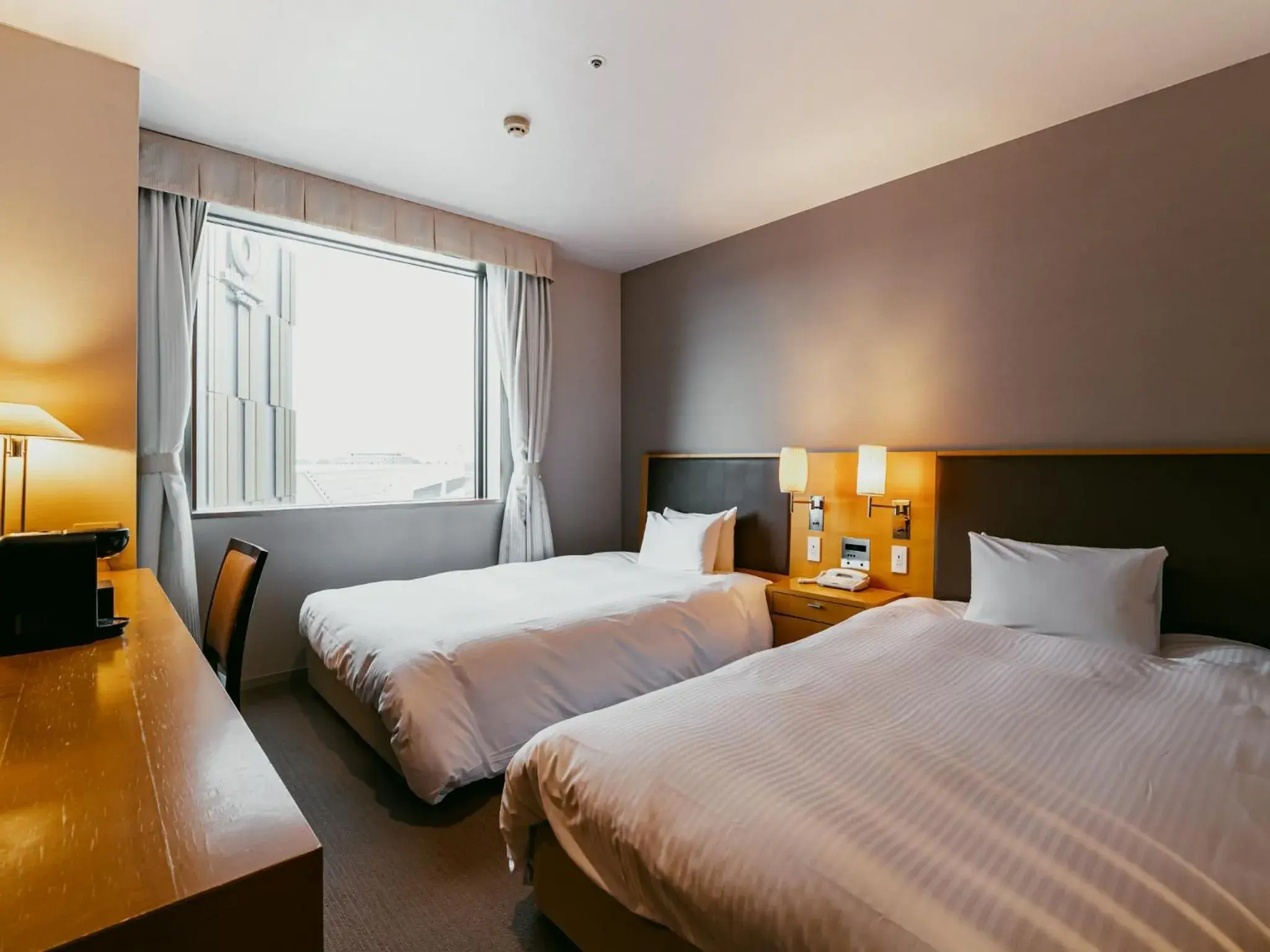 Bed in Oarks Canal Park Hotel Toyama