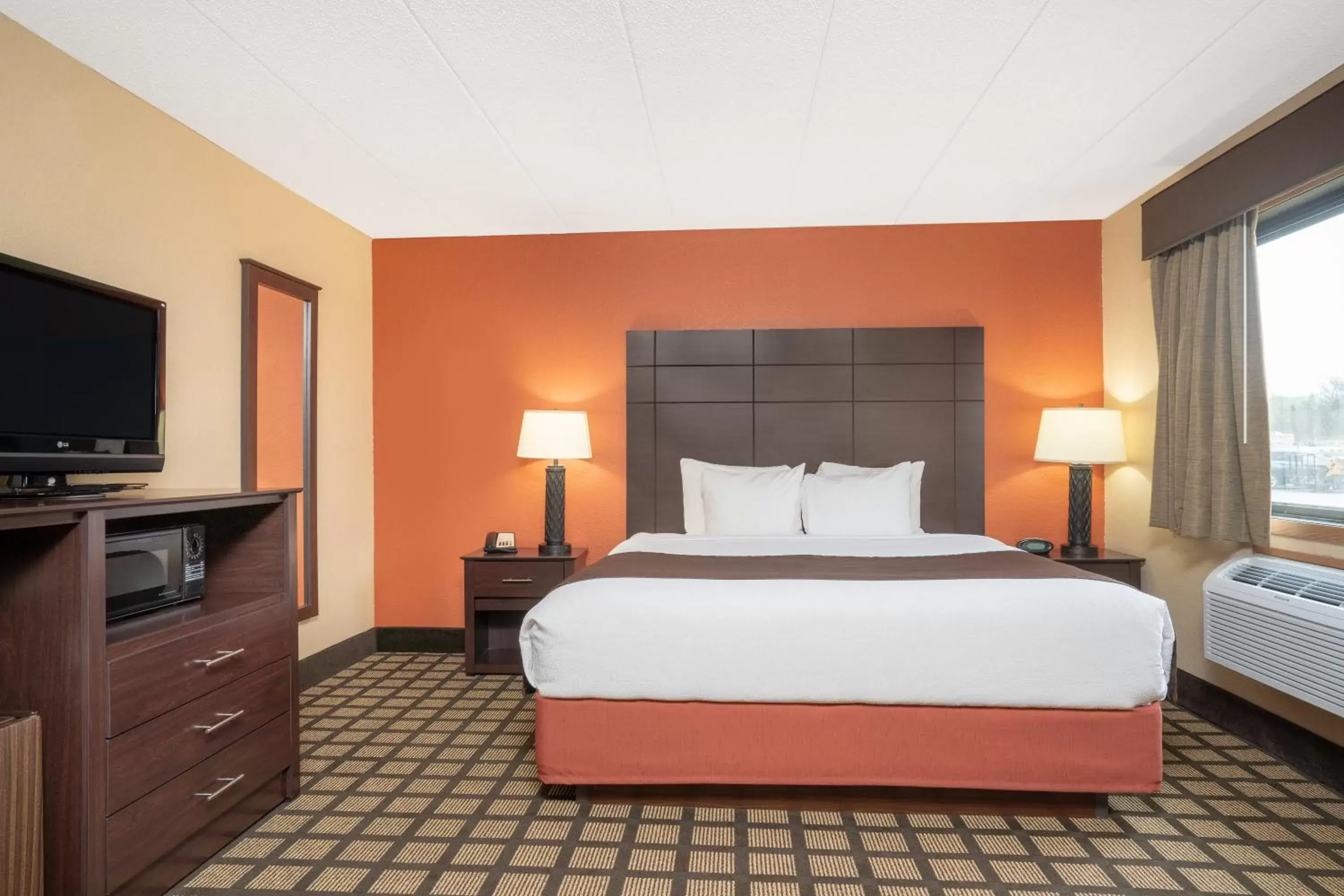 Bed in Baymont by Wyndham Lakeville