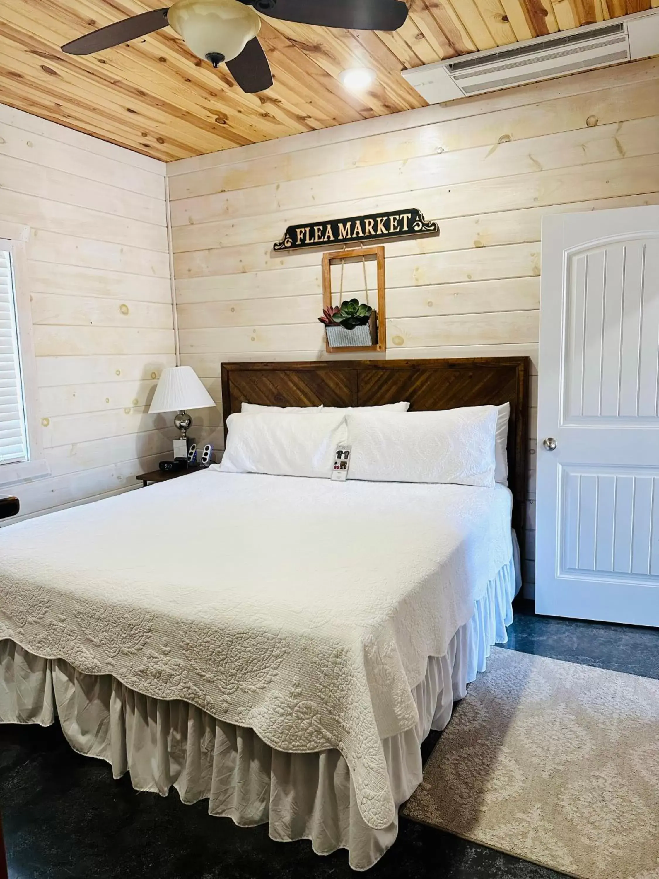 Bed in Knotty Squirrel Cabins