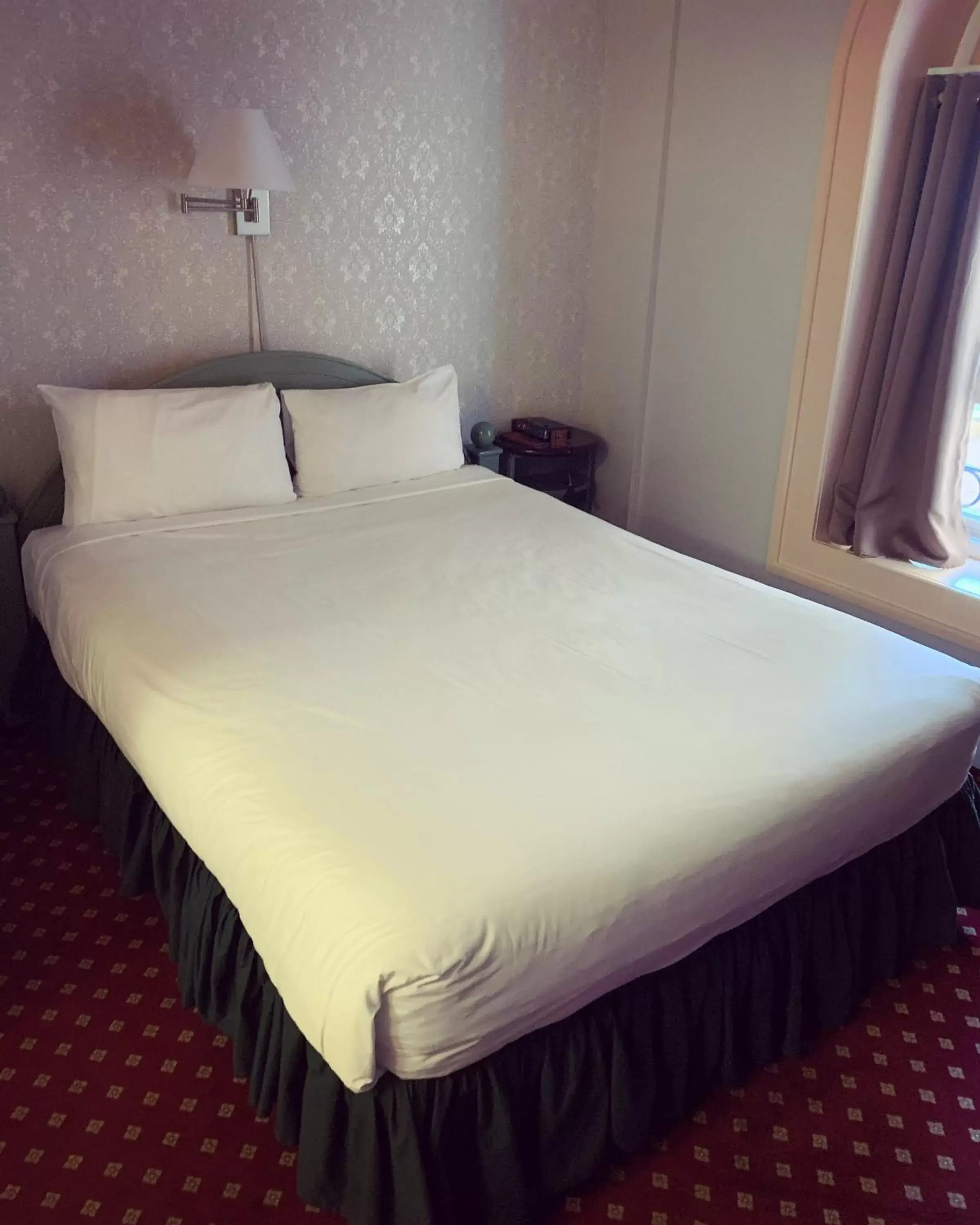 Bed in The Bedford Regency Hotel