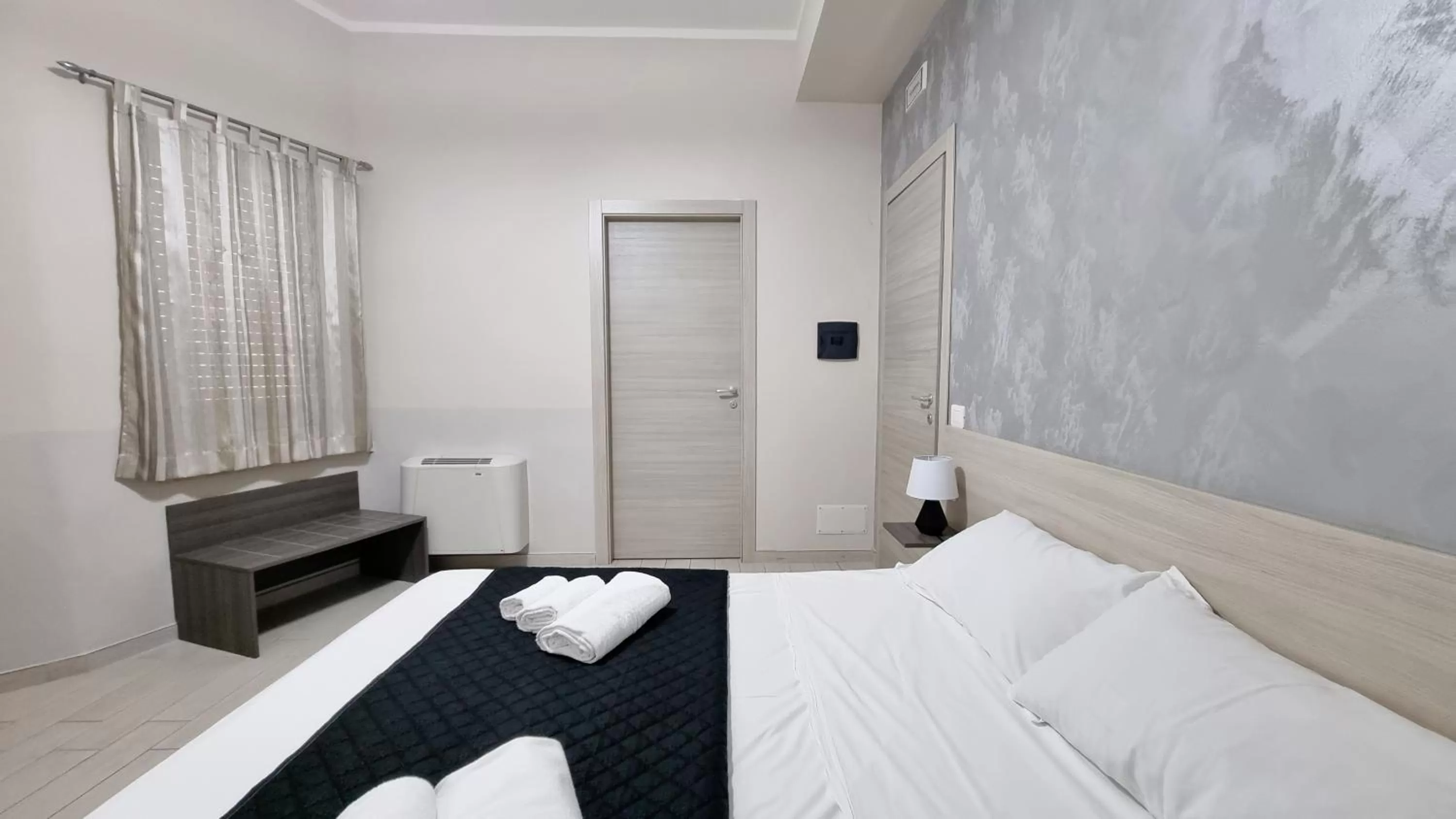 Photo of the whole room, Bed in Residenza Atena