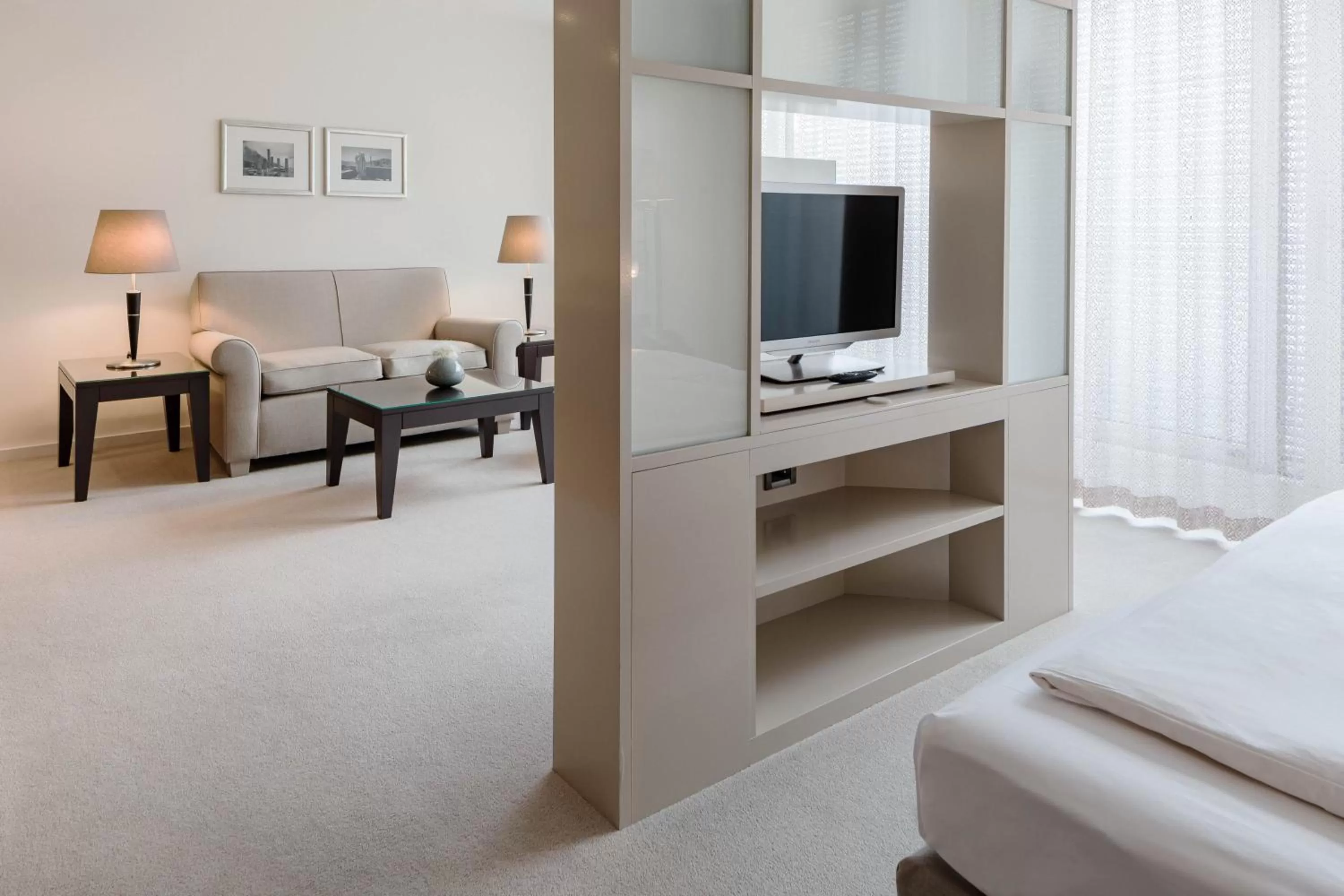 Living room, Bed in The Mandala Berlin, a Member of Design Hotels