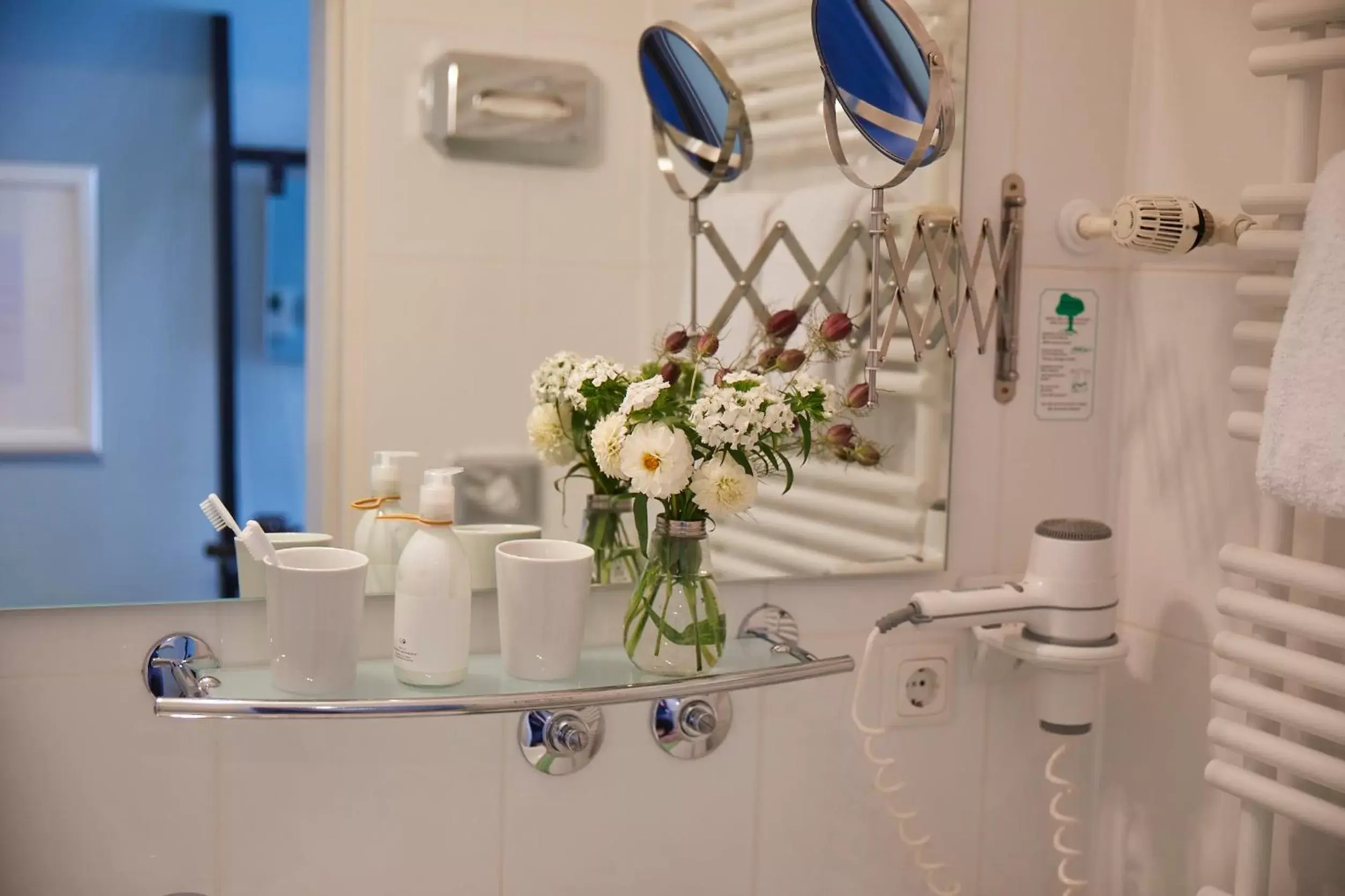 Bathroom in Hotel Metropol by Maier Privathotels