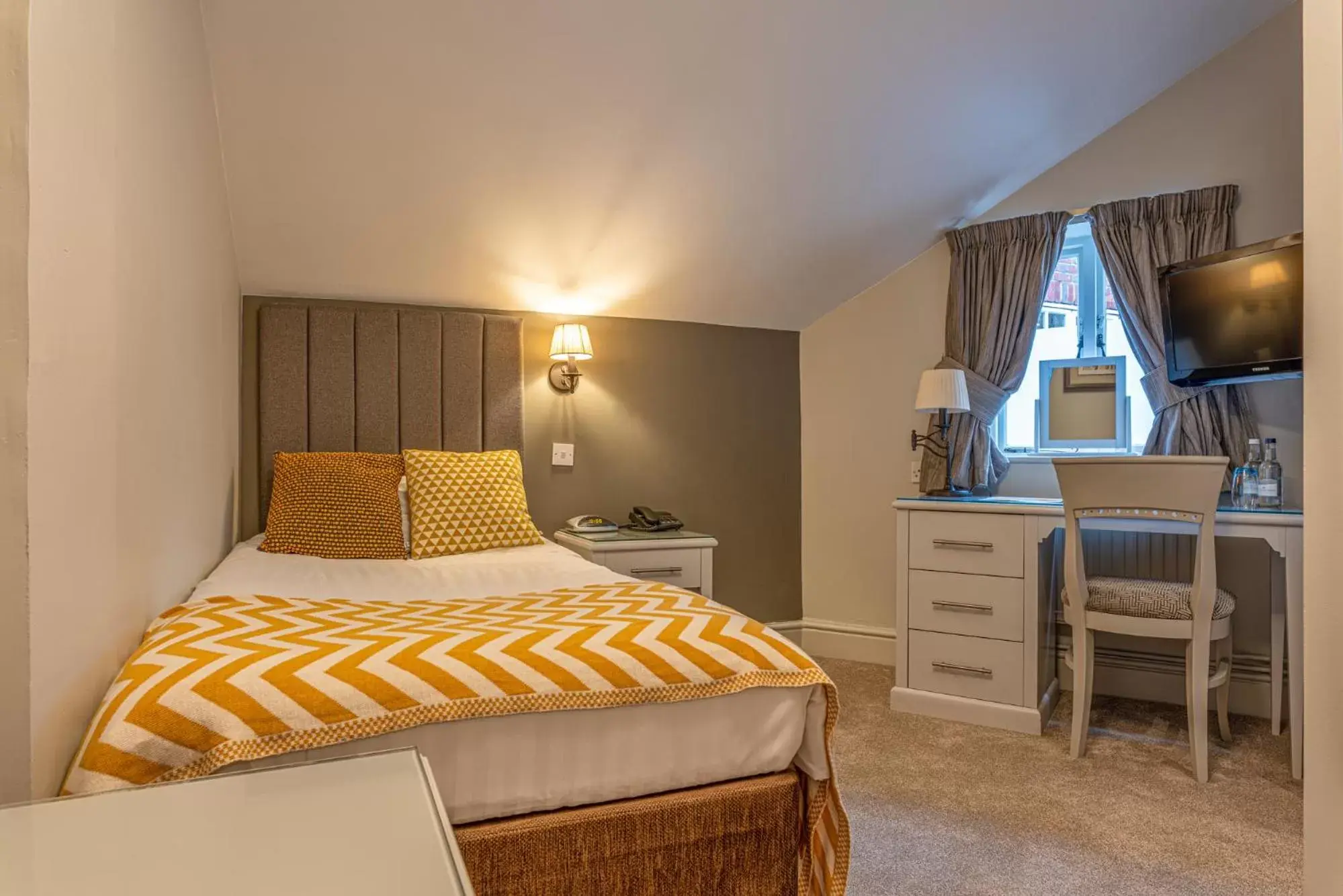 Bed in The Dog & Bear Hotel Bed in The Dog & Bear Hotel