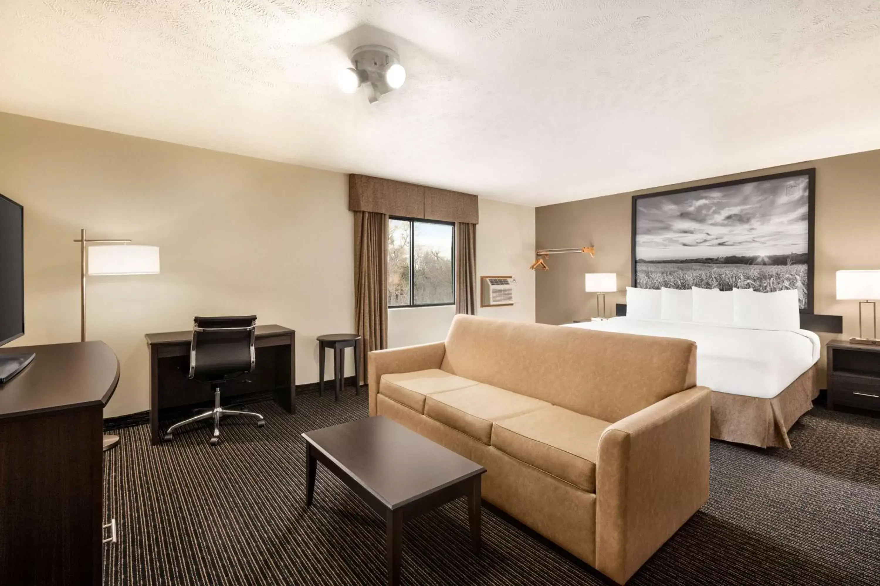 Bed, Seating Area in Super 8 by Wyndham Lincoln North