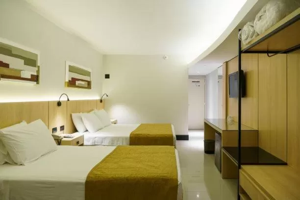 Bed in Rafain Palace Hotel & Convention Center