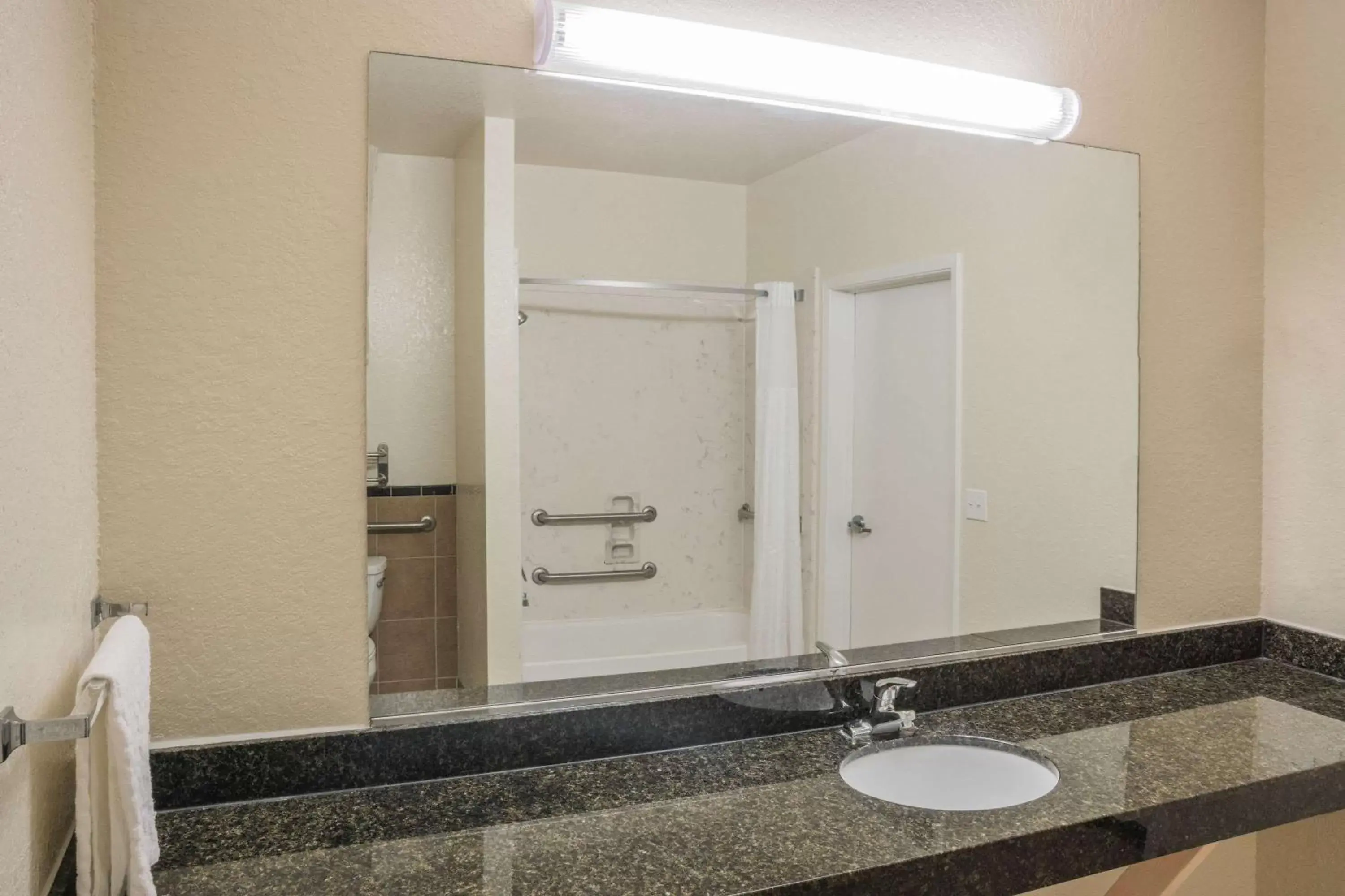 Bathroom in Super 8 by Wyndham Brookshire TX