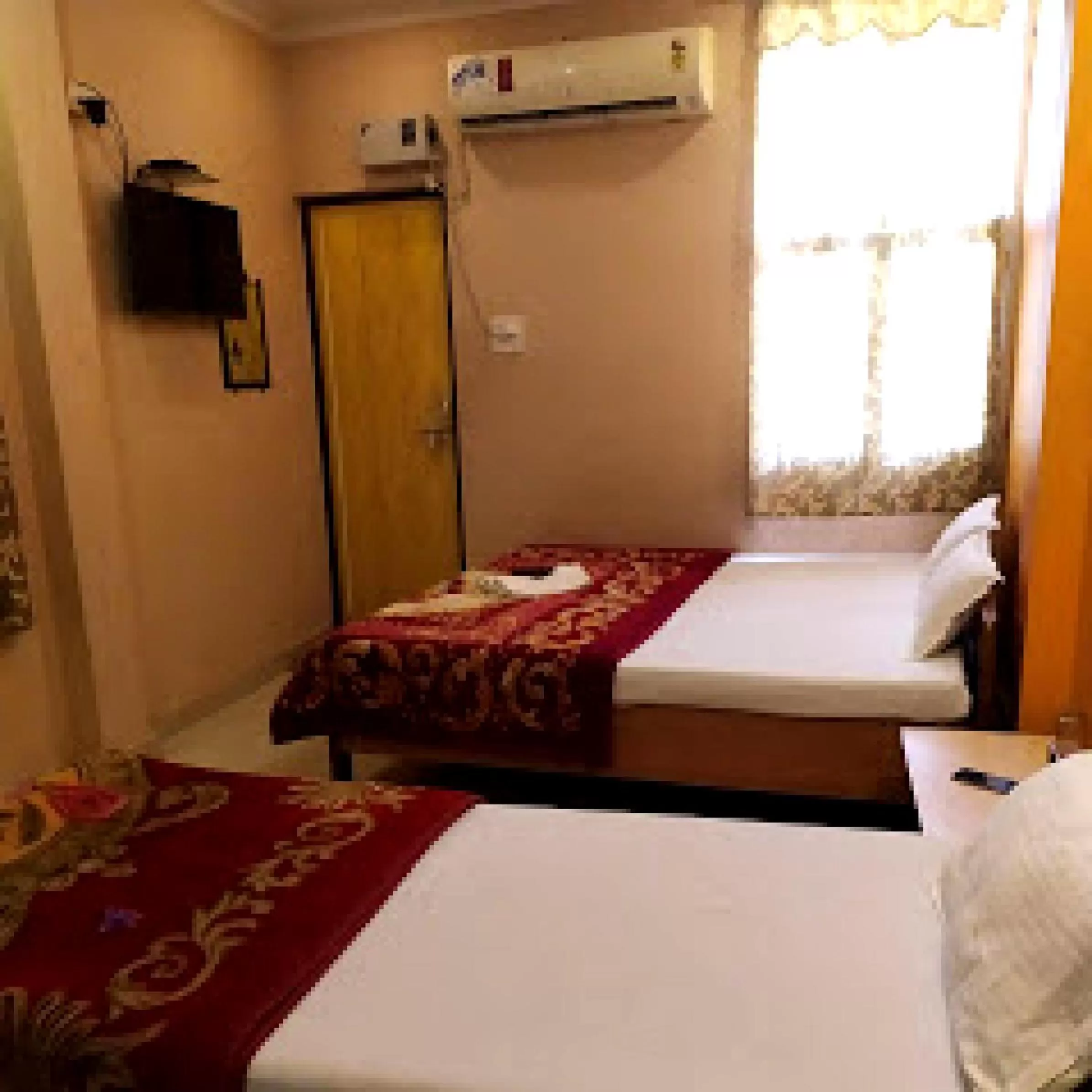 Bed in Hotel Aakash Ganga