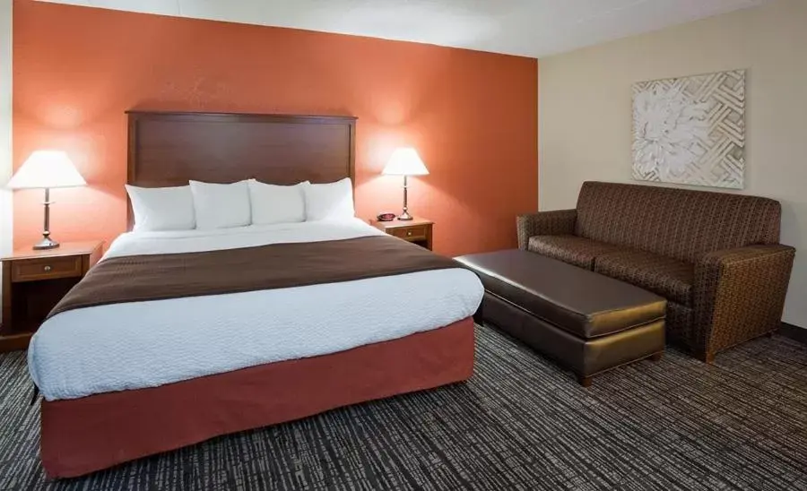 Bed in AmericInn by Wyndham Alexandria