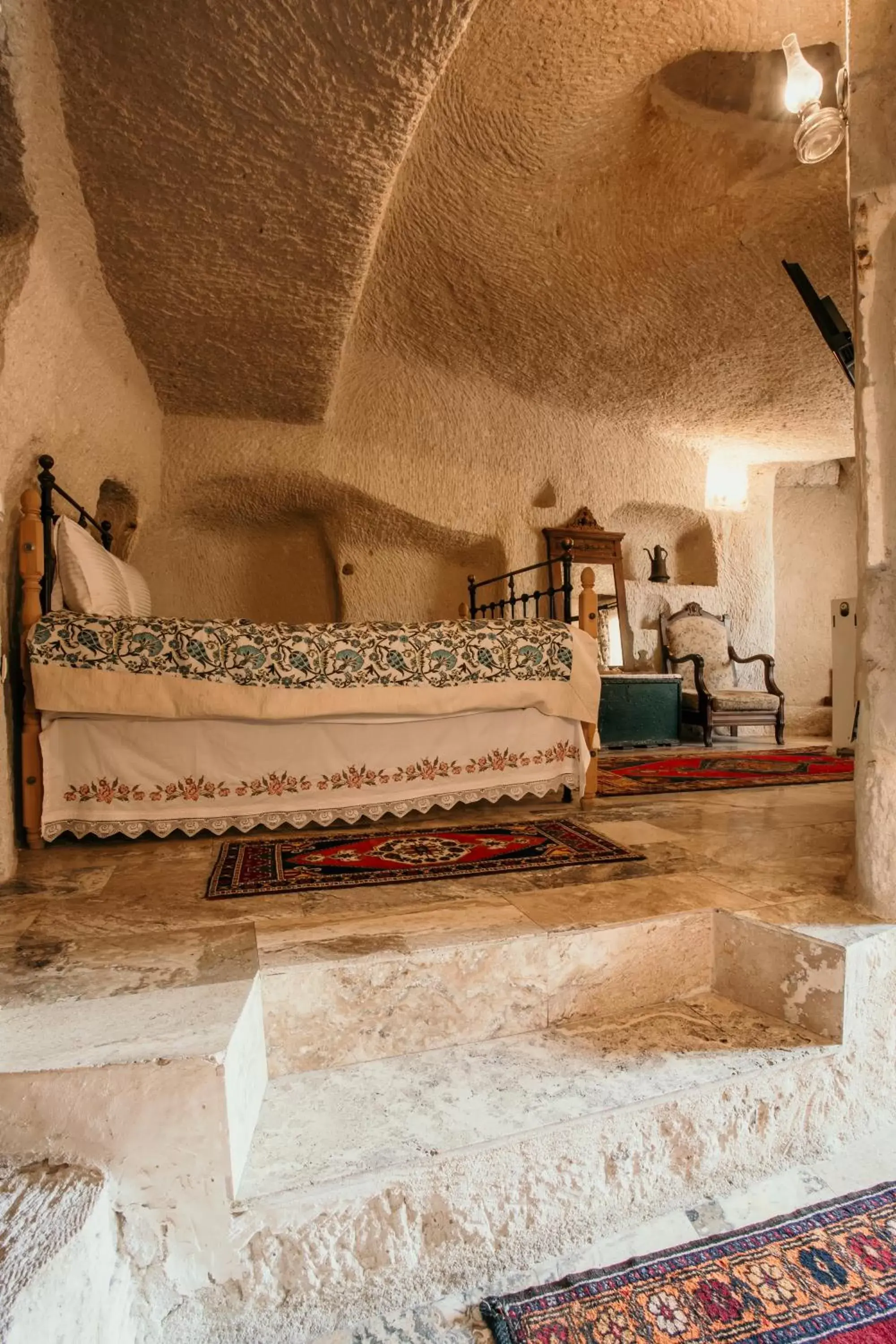 Bed in Village Cave House Hotel