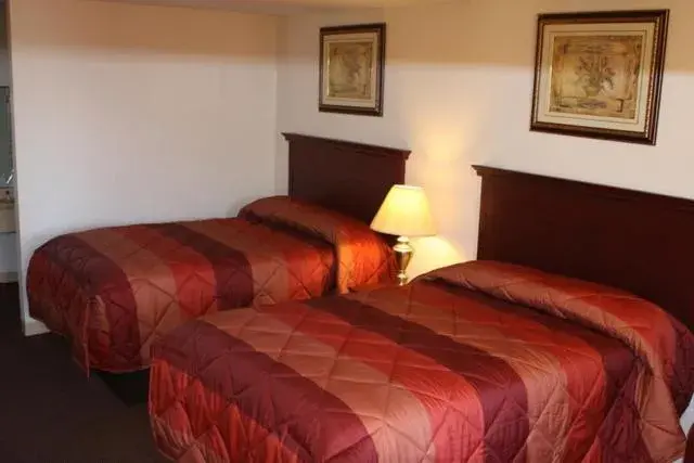 Bed in Executive Inn Brookshire