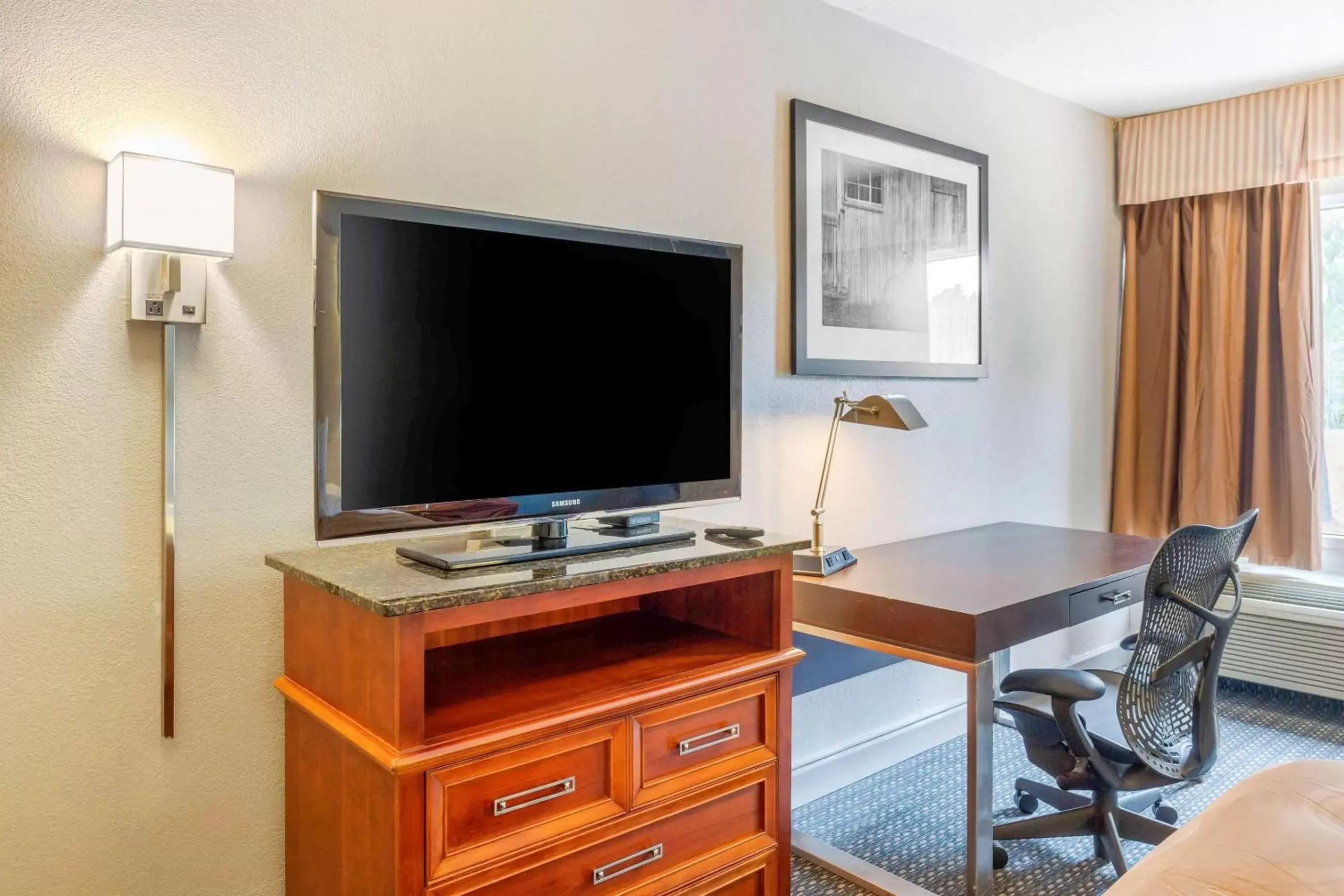 Photo of the whole room, TV/Entertainment Center in Quality Inn & Suites Apex-Holly Springs