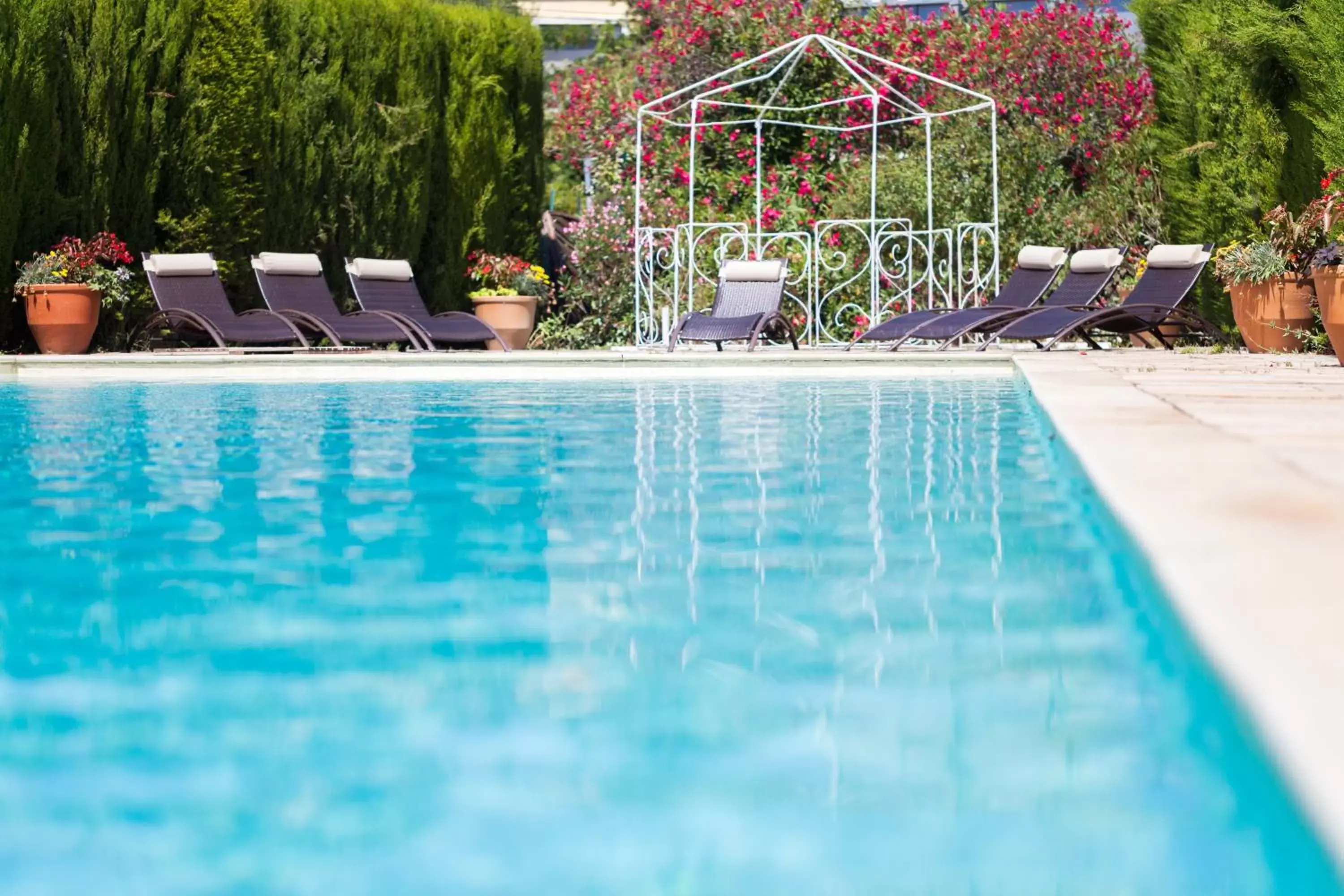 Swimming Pool in Logis VIGNES BLANCHES*** Hôtel Cosy et restaurant de terroir