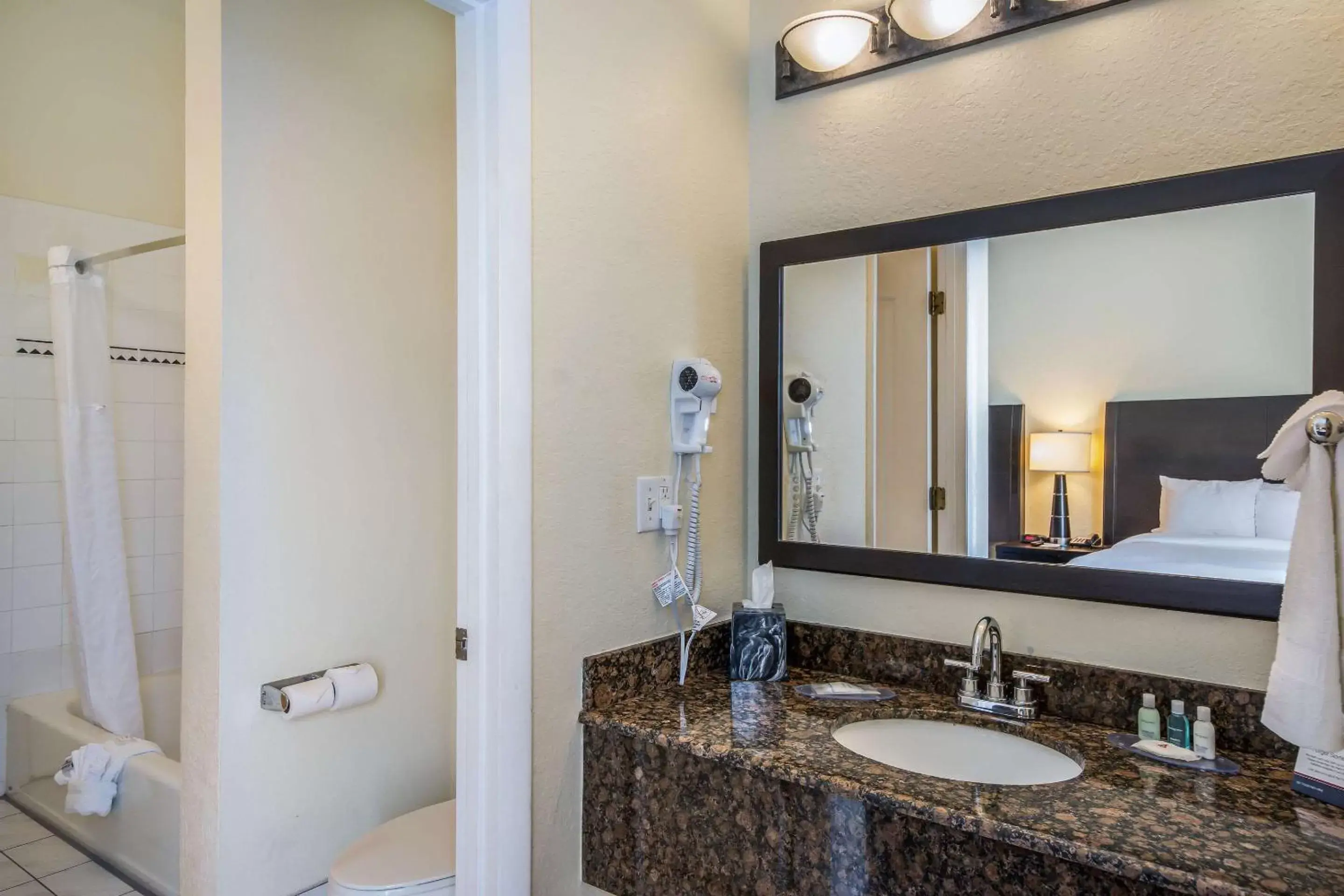 Photo of the whole room, Bathroom in Clarion Inn & Suites Central Clearwater Beach