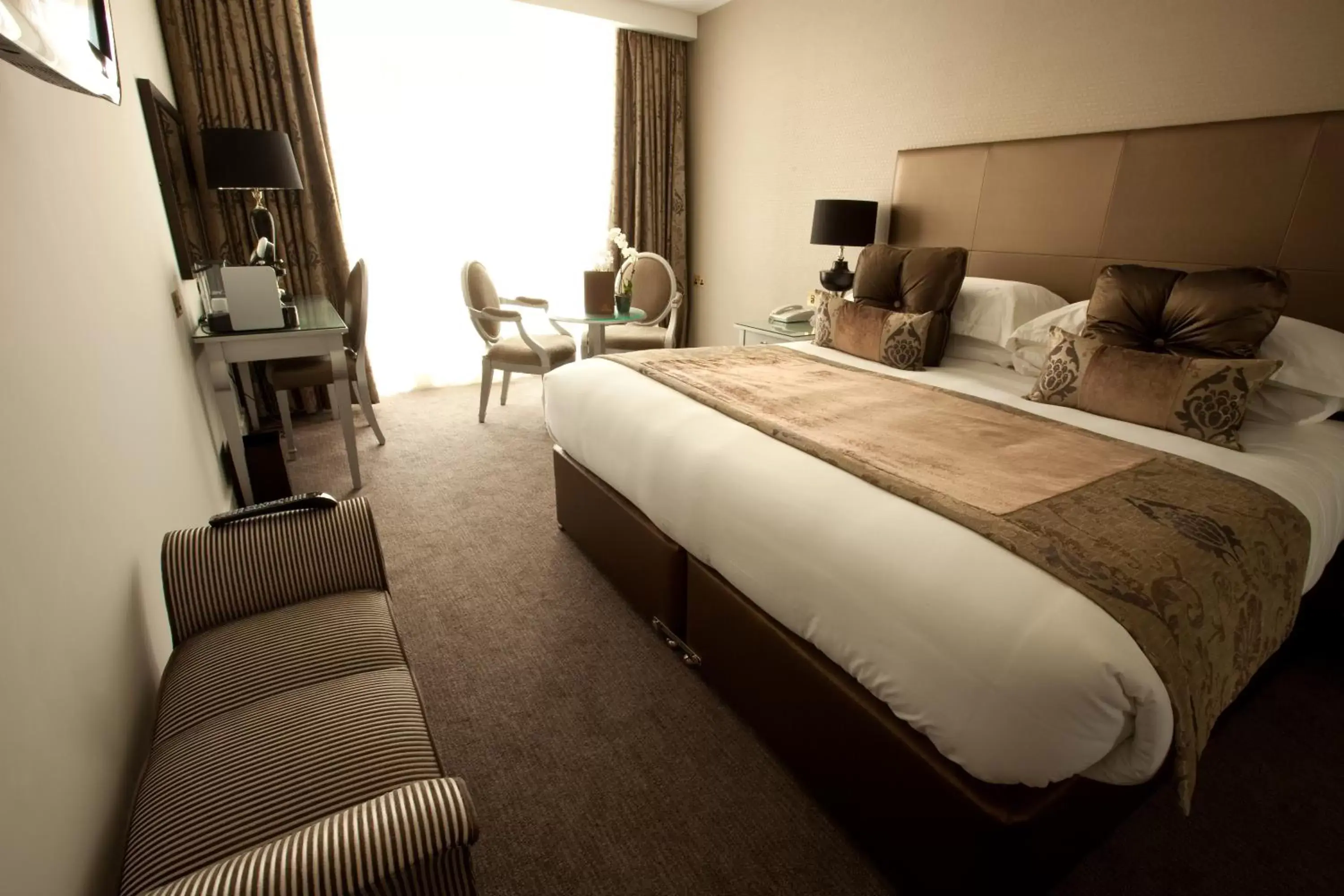 Bed in The Oxfordshire Golf & Spa Hotel
