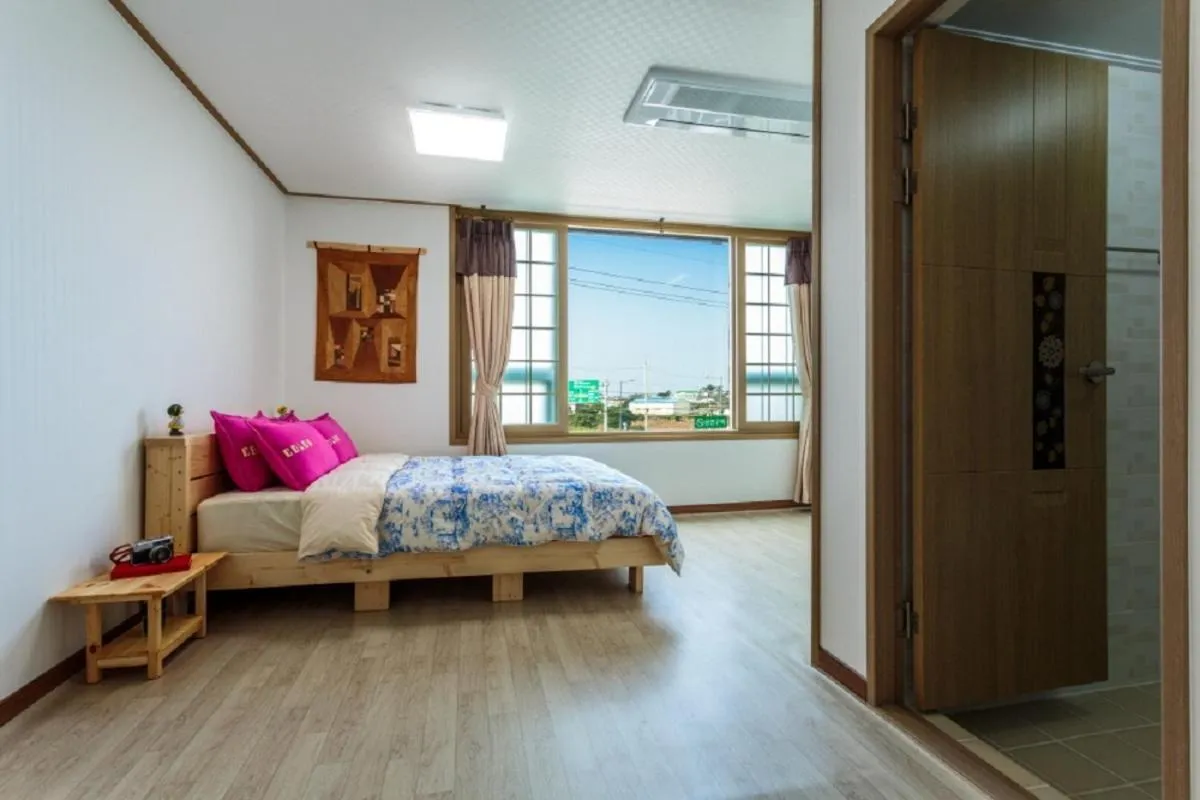 Bathroom, Bed in Jeju Wayo Pension