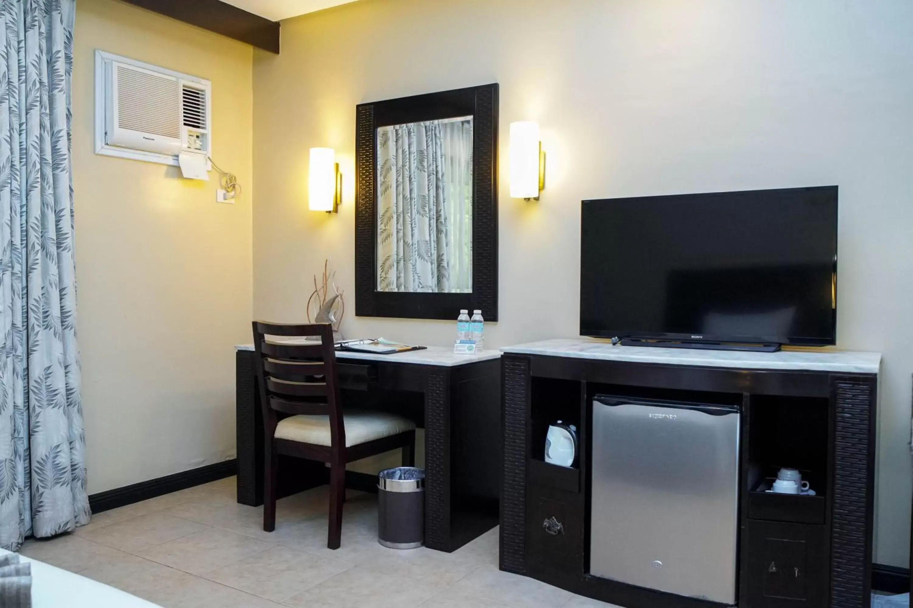 air conditioner, TV/Entertainment Center in Coron Westown Resort