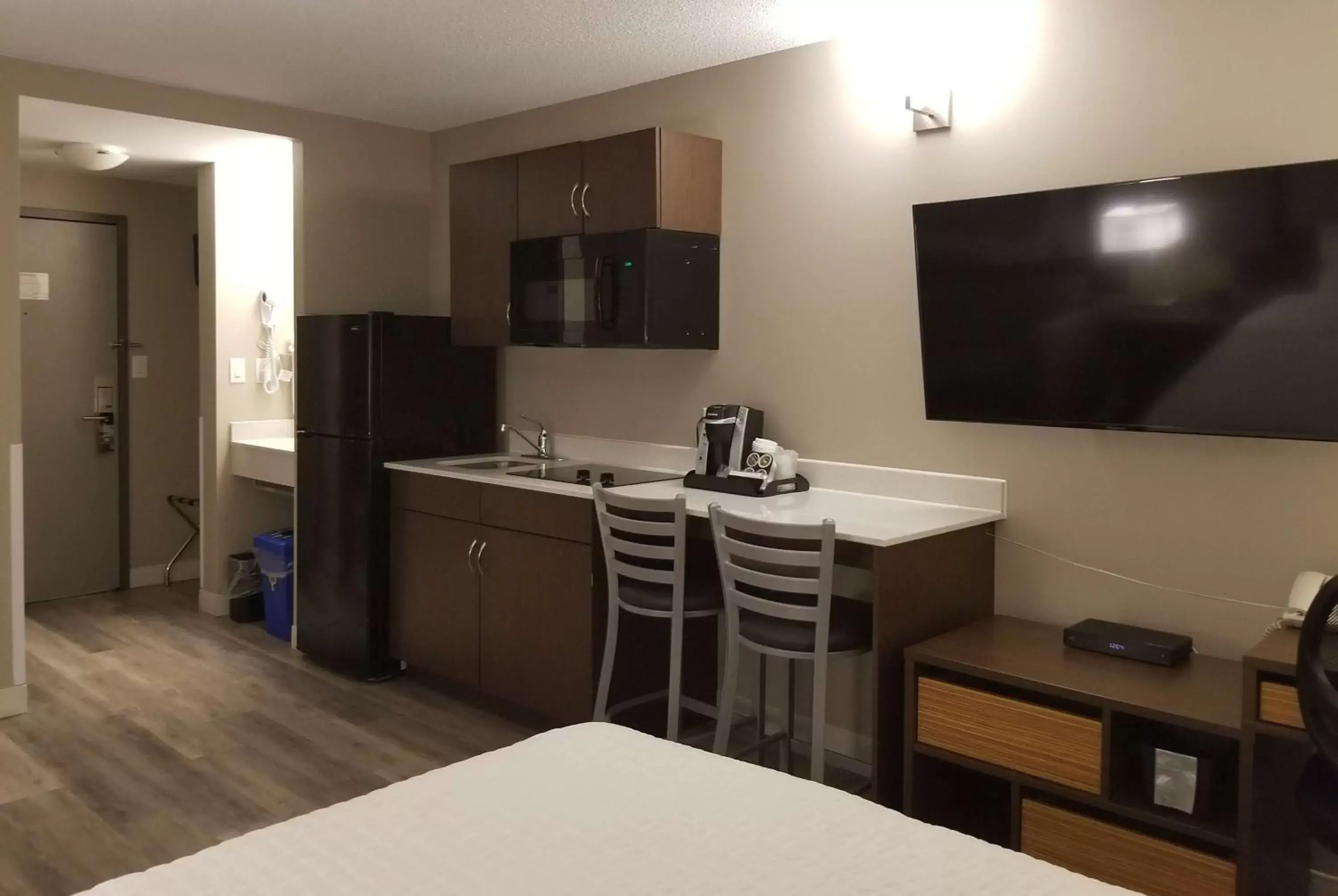 Photo of the whole room, TV/Entertainment Center in Super 8 by Wyndham Winnipeg West