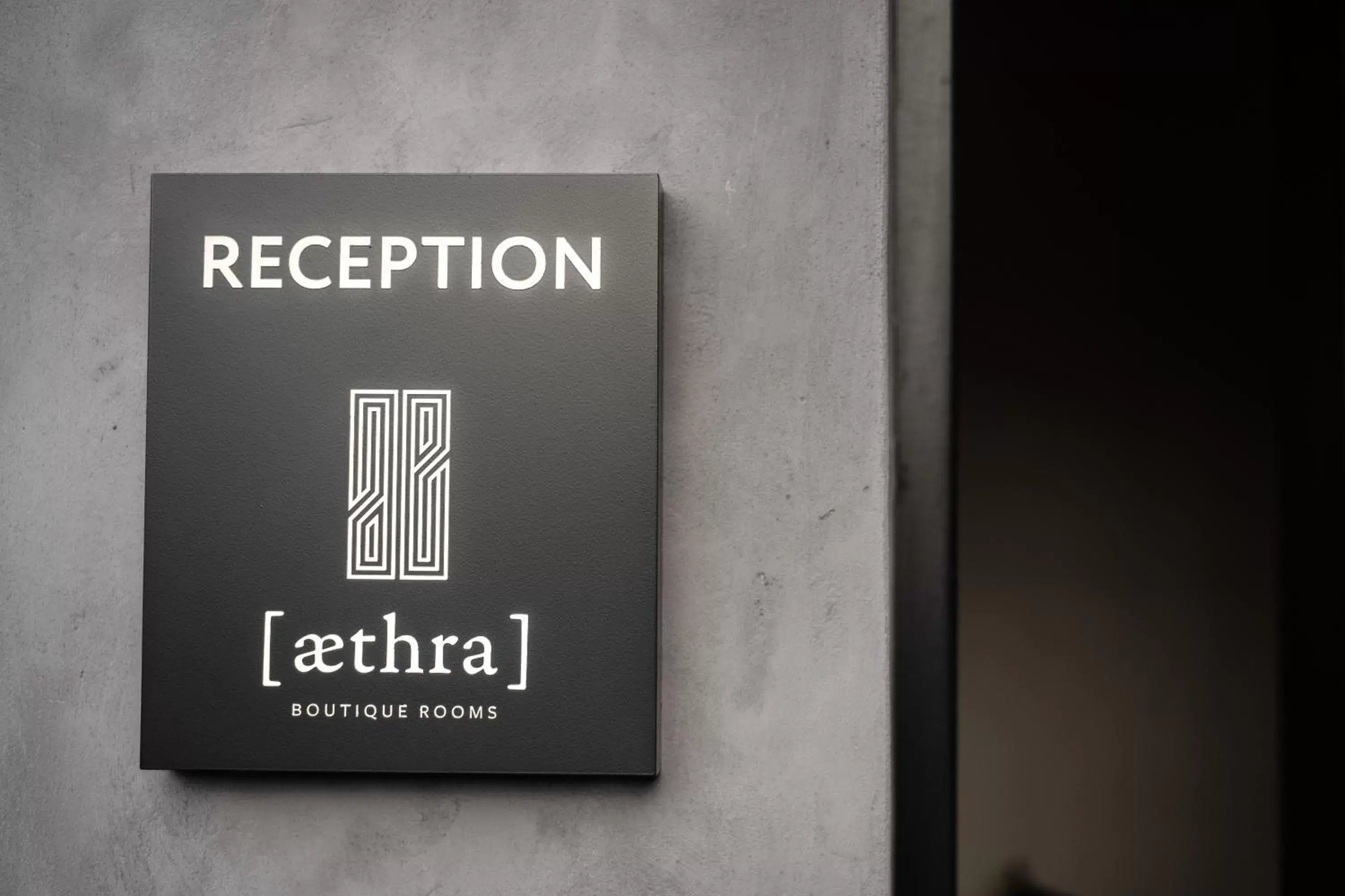 Property logo or sign in Aethra Boutique Rooms