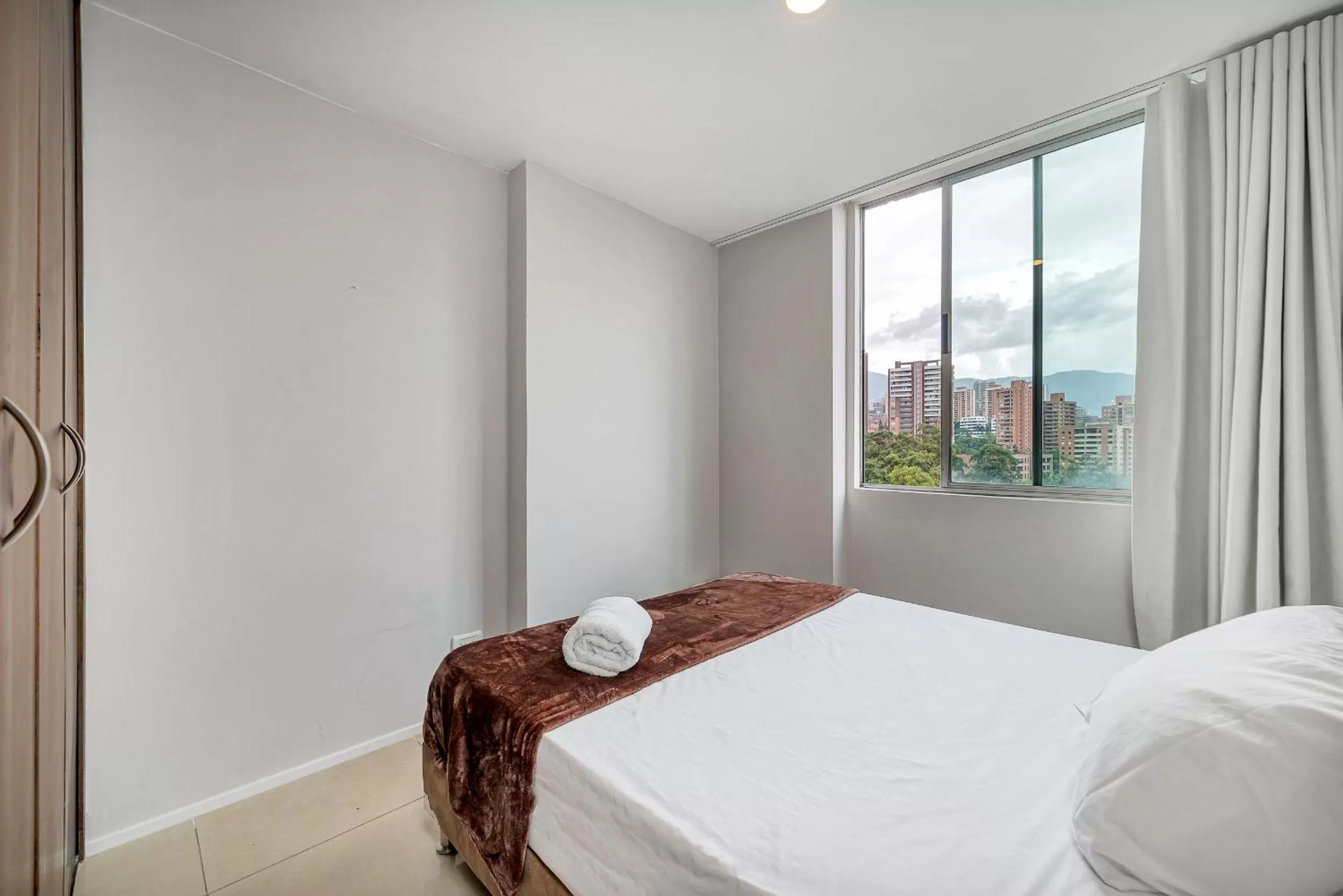 Bedroom, Bed in Apartamentos Poblado Alejandría by HOUSY HOST