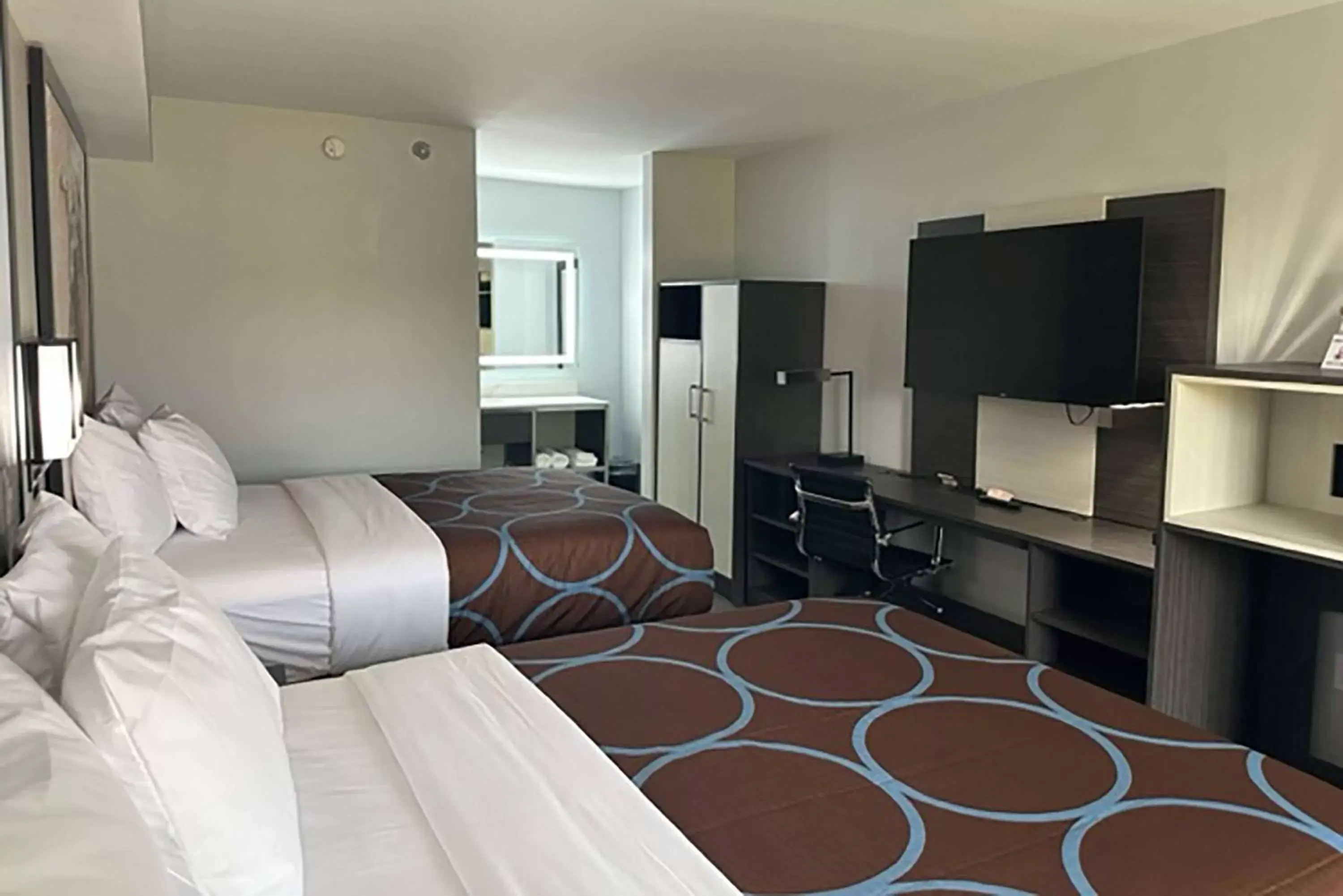 Bed, TV/Entertainment Center in Super 8 by Wyndham Baltimore Northwest