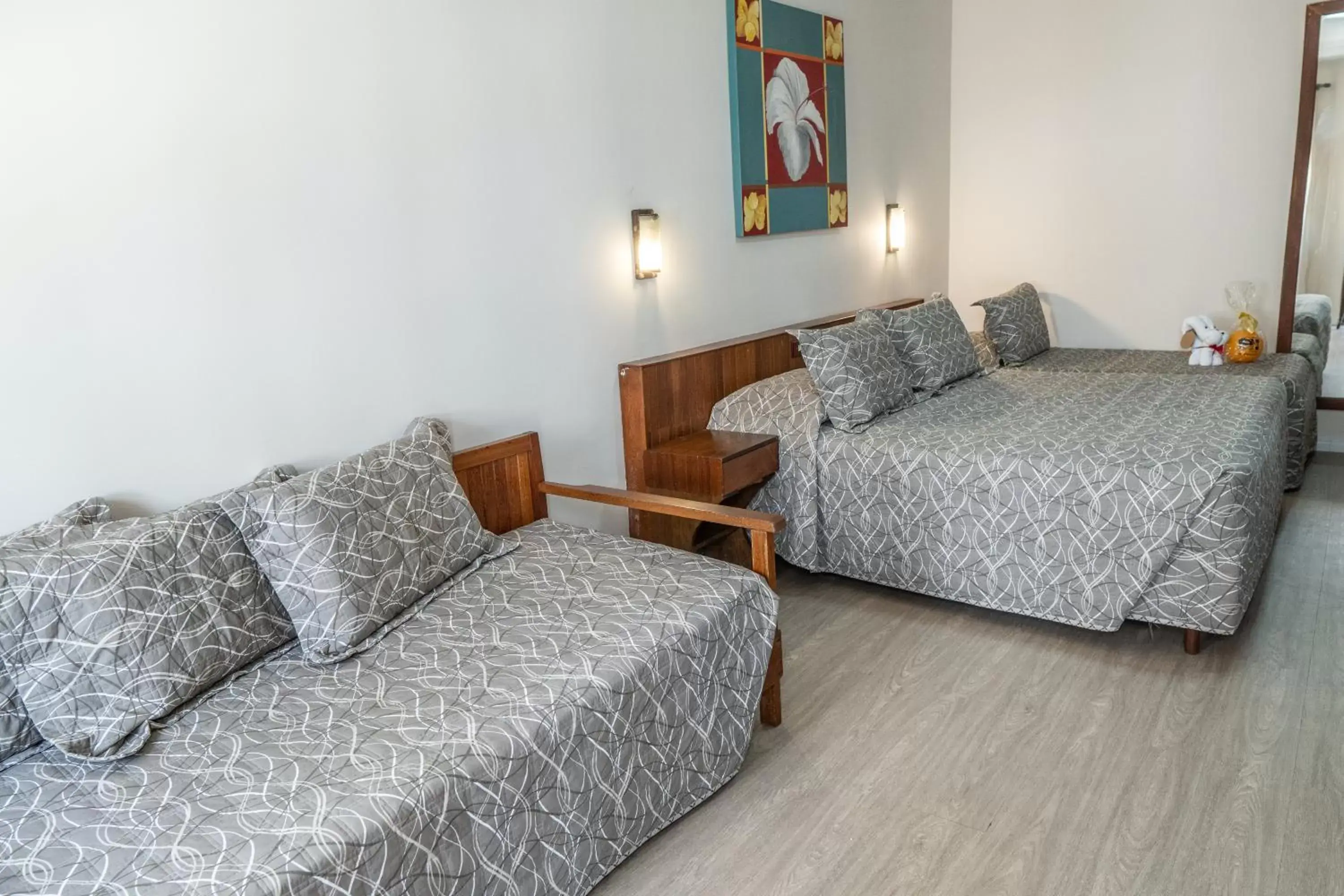 Bed, Seating Area in Strand Hotel Guarujá Frente Mar