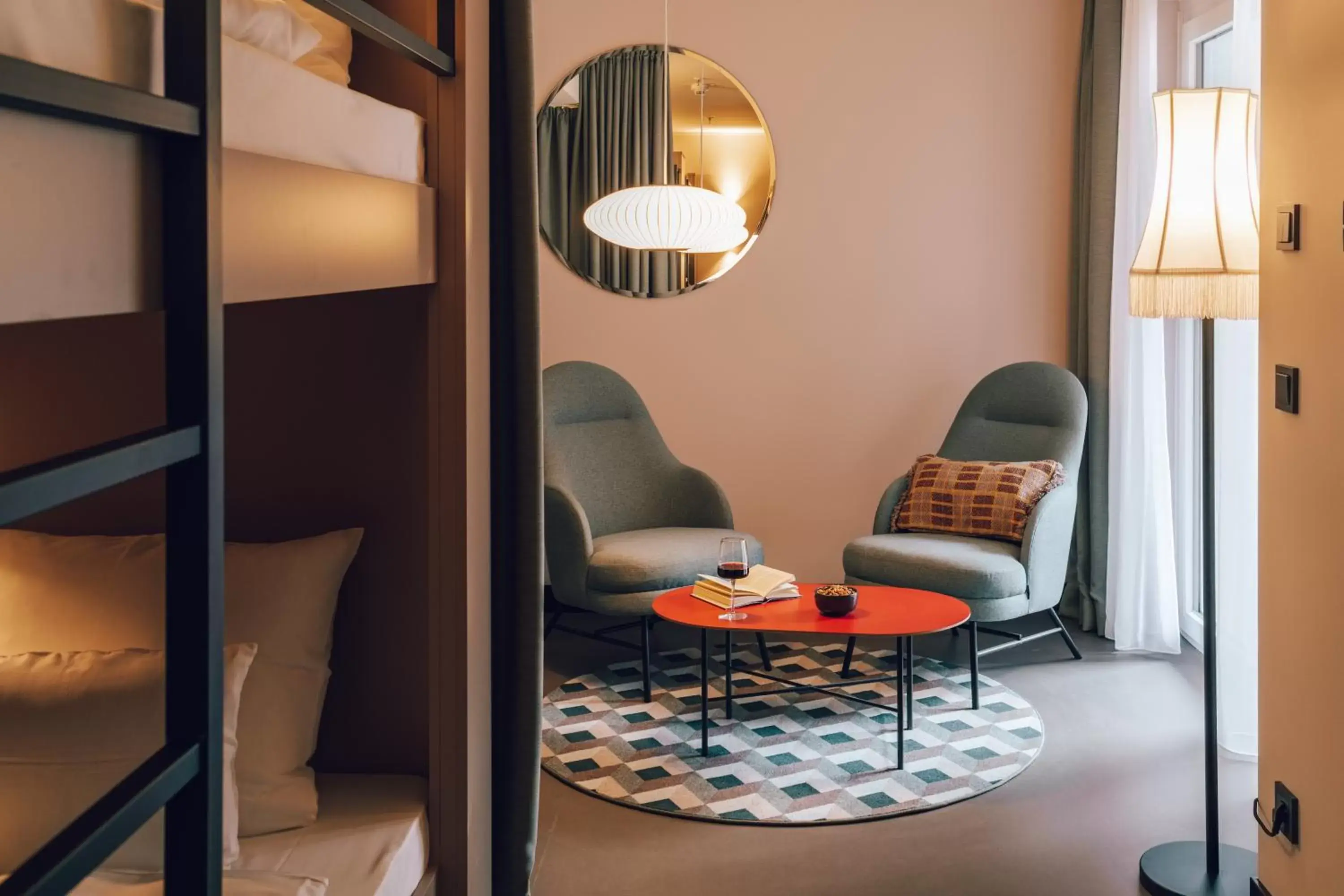 Seating area, Bed in Revo Munich Seating area, Bed in Revo Munich