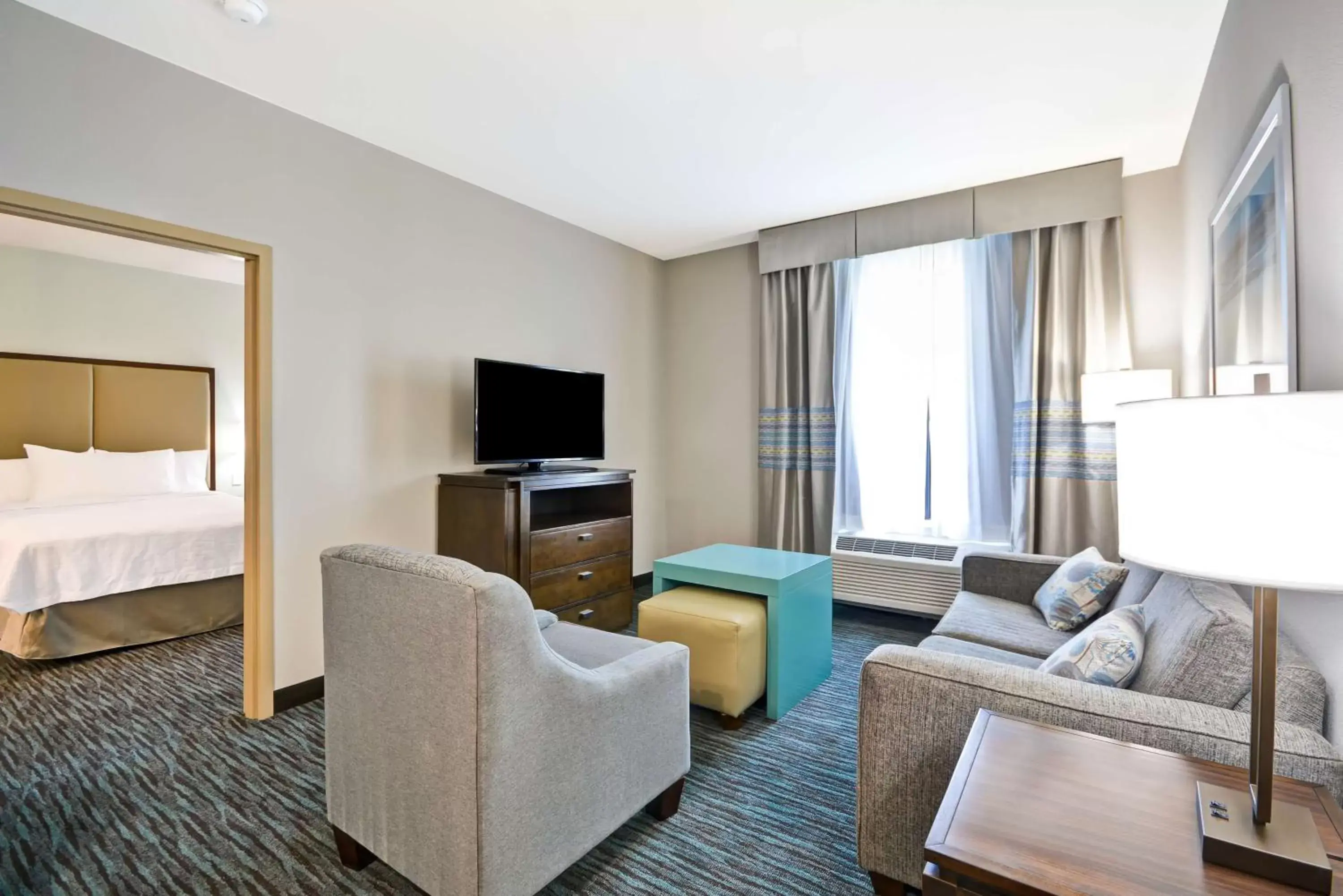 Bed, Seating Area in Homewood Suites By Hilton Galveston