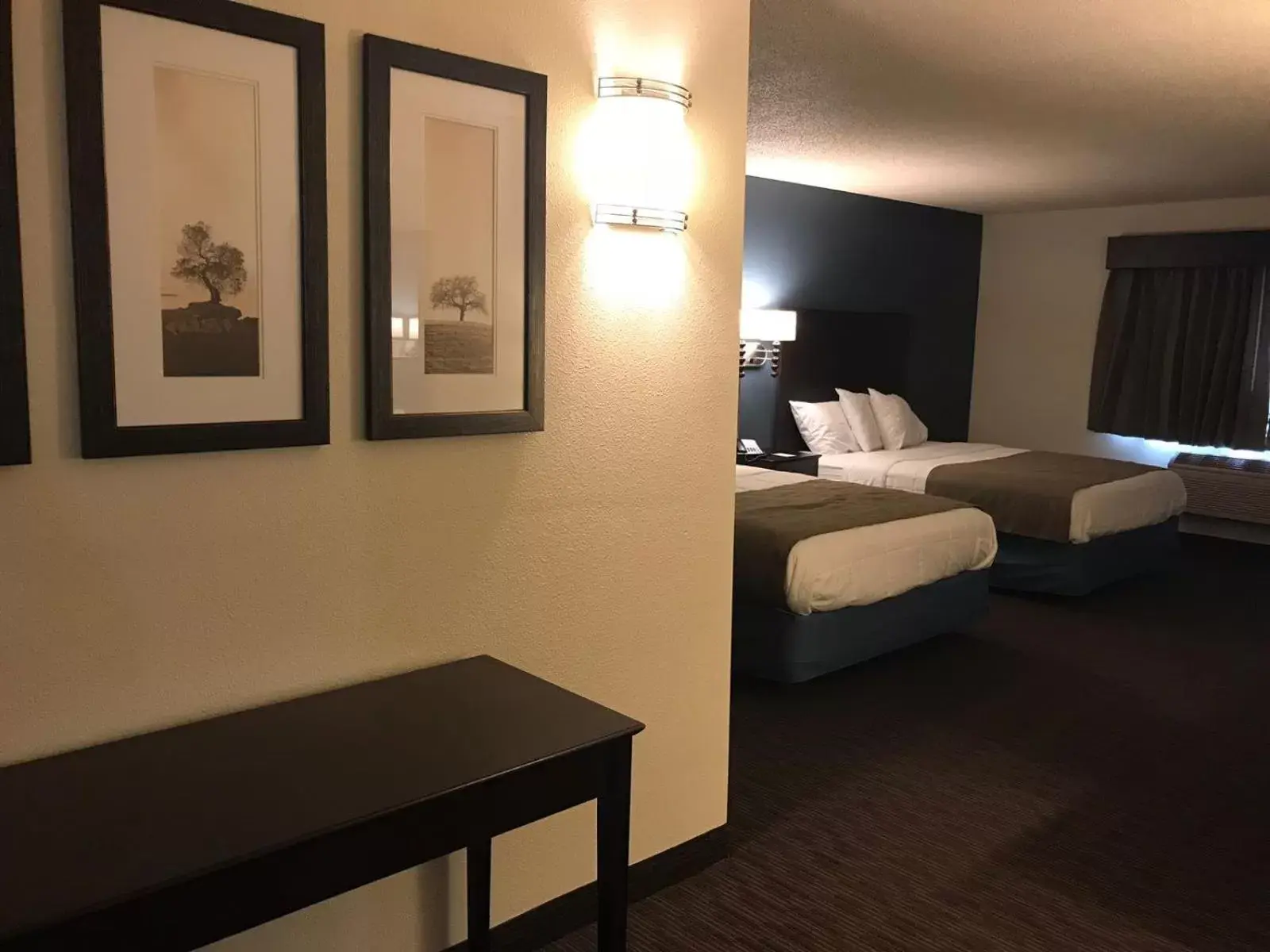 Photo of the whole room, Bed in AmericInn by Wyndham Hotel and Suites Long Lake