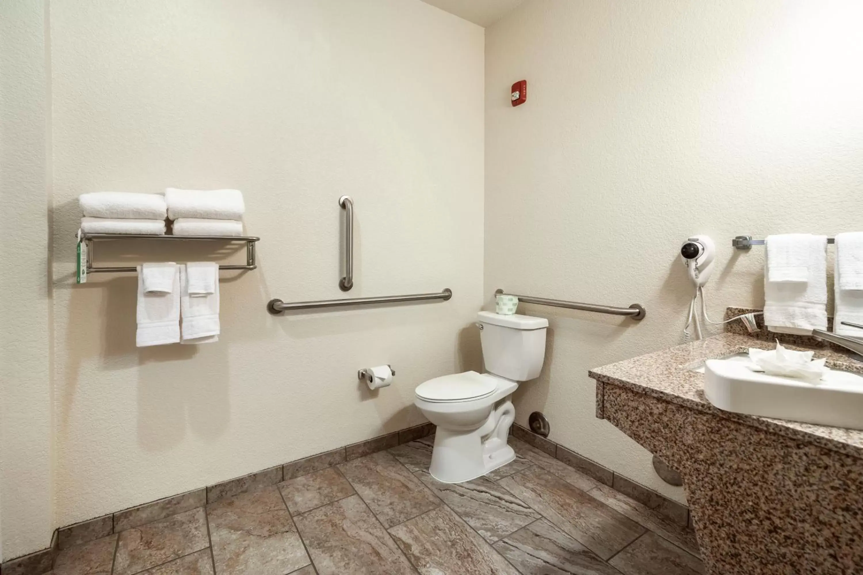 Toilet, Bathroom in Cobblestone Hotel & Suites - Hutchinson