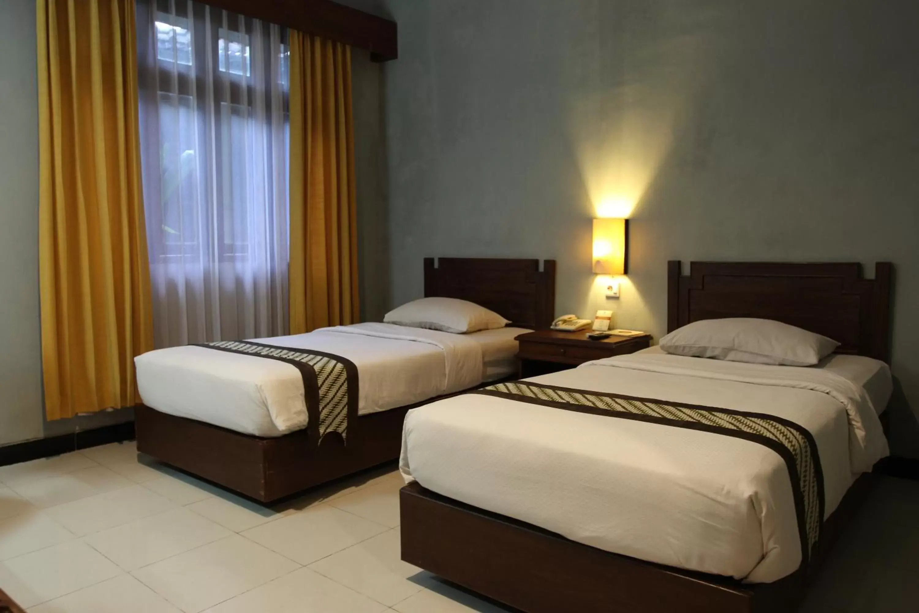 Bed in Cakra Kusuma Hotel