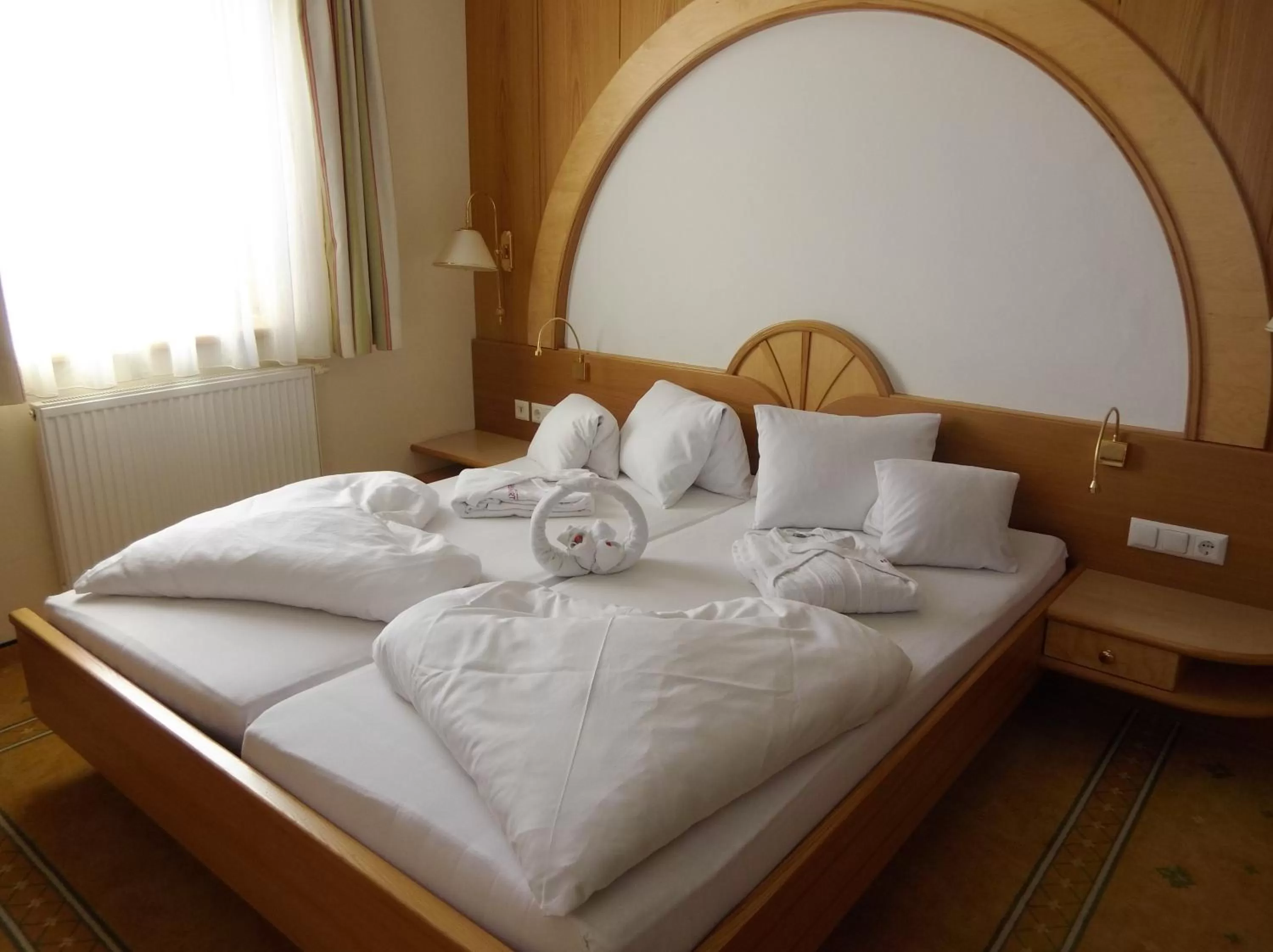 Bed in Hotel Neuwirt