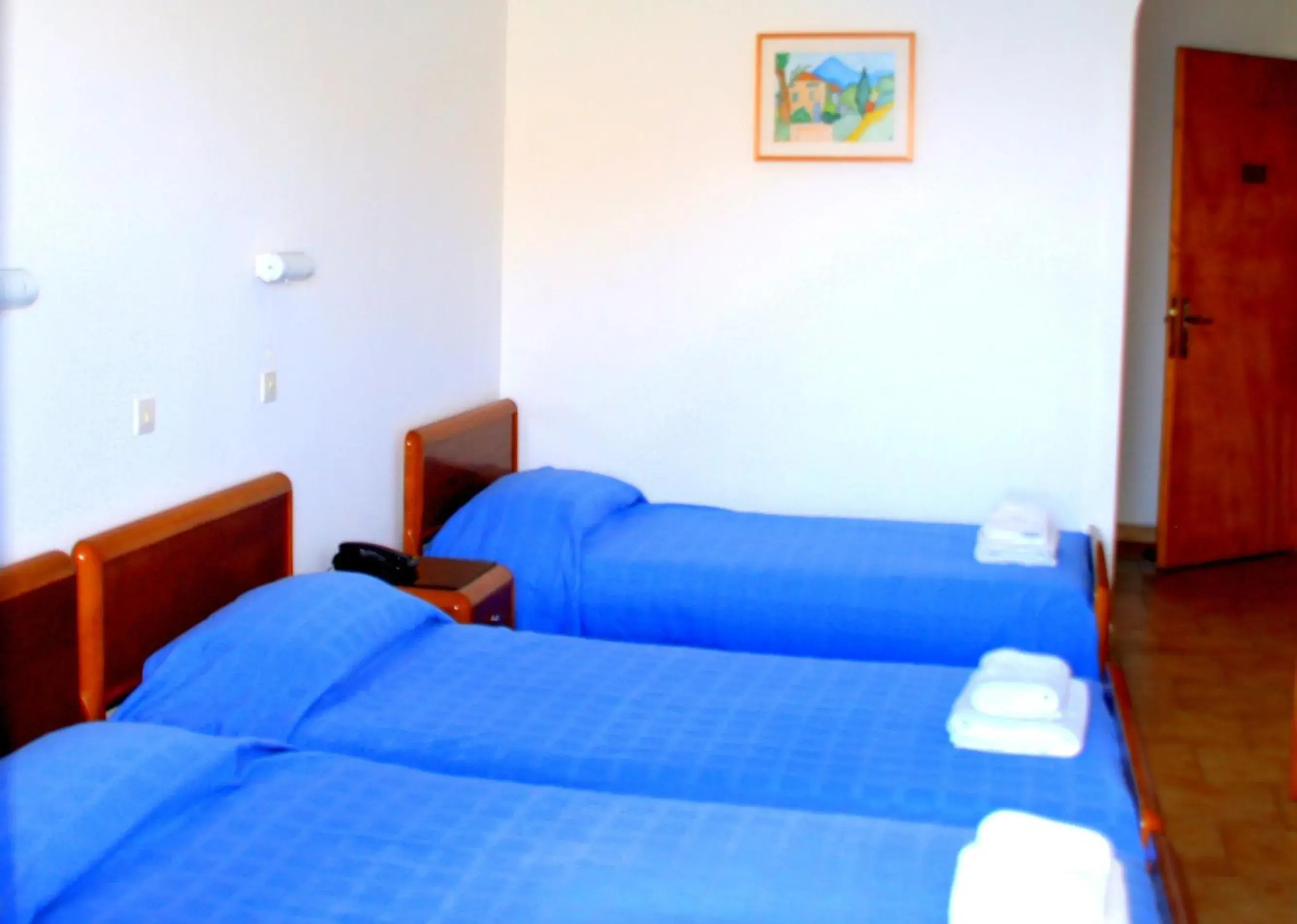 Photo of the whole room, Bed in Blue Bay Hotel