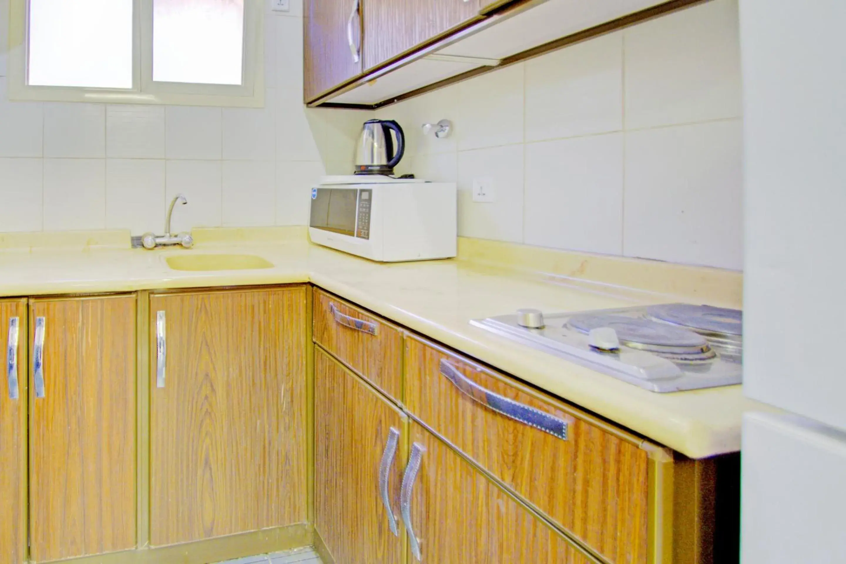 Kitchen or kitchenette, Kitchen/Kitchenette in OYO 401 Al Zaidan For Furnished Units