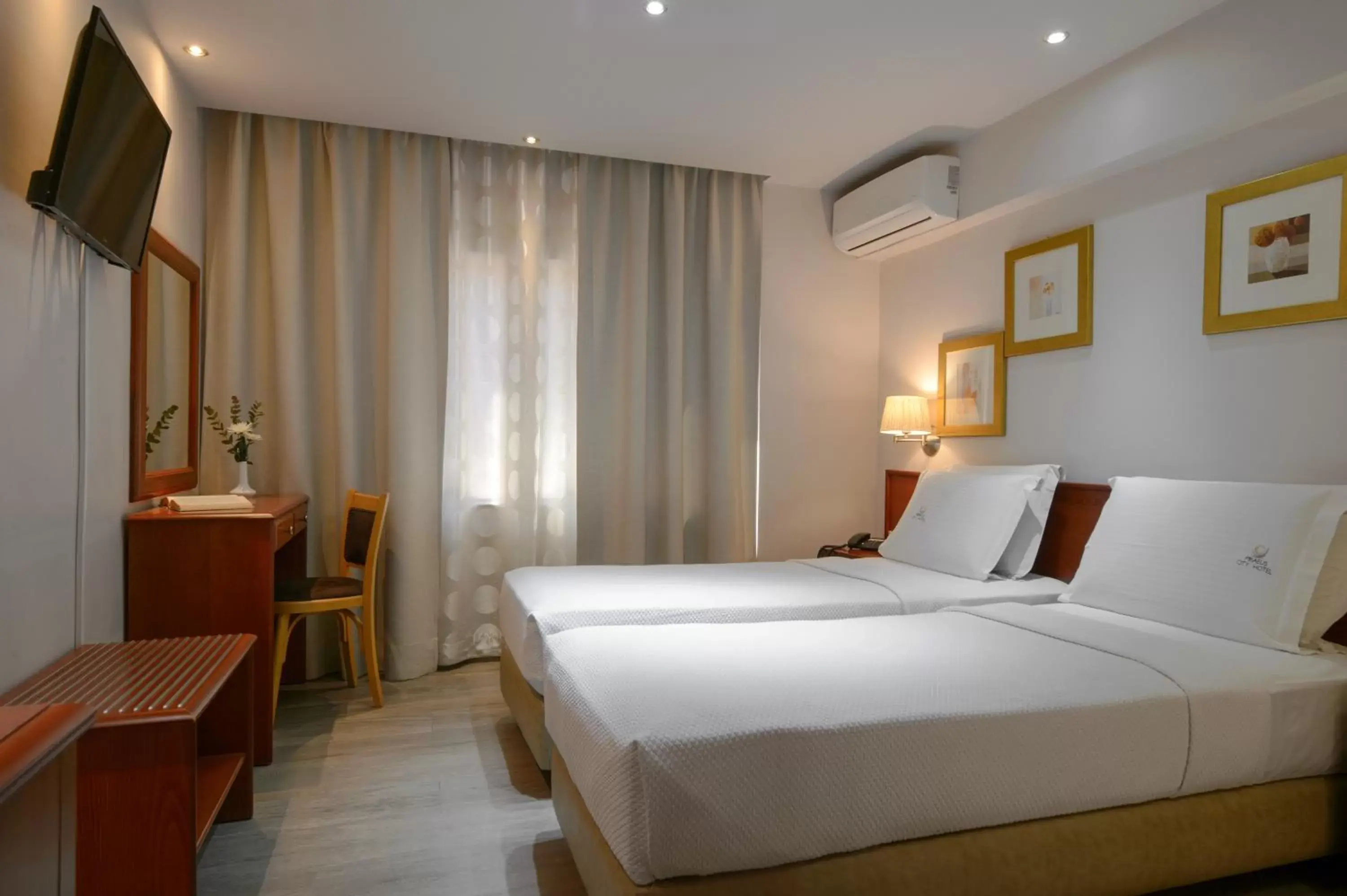 Bed in Piraeus City Hotel