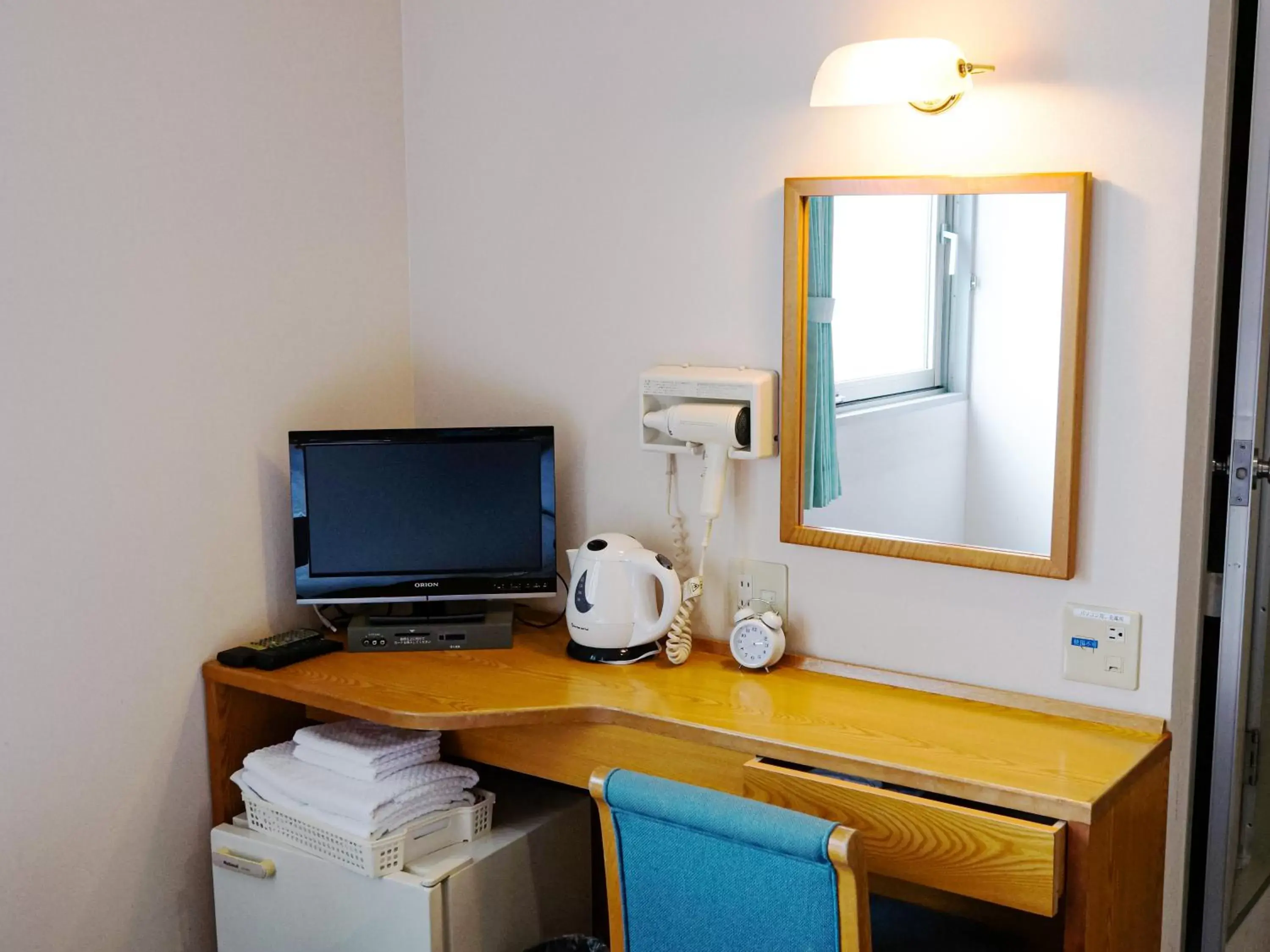 Photo of the whole room, TV/Entertainment Center in Hotel Abest Kochi