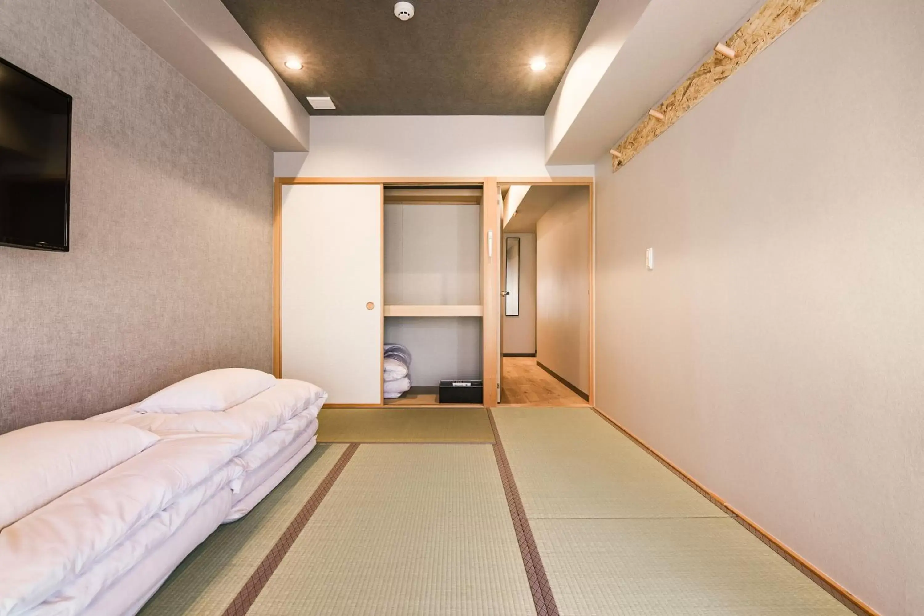 Bed in Wayfarer Kyoto Shijo