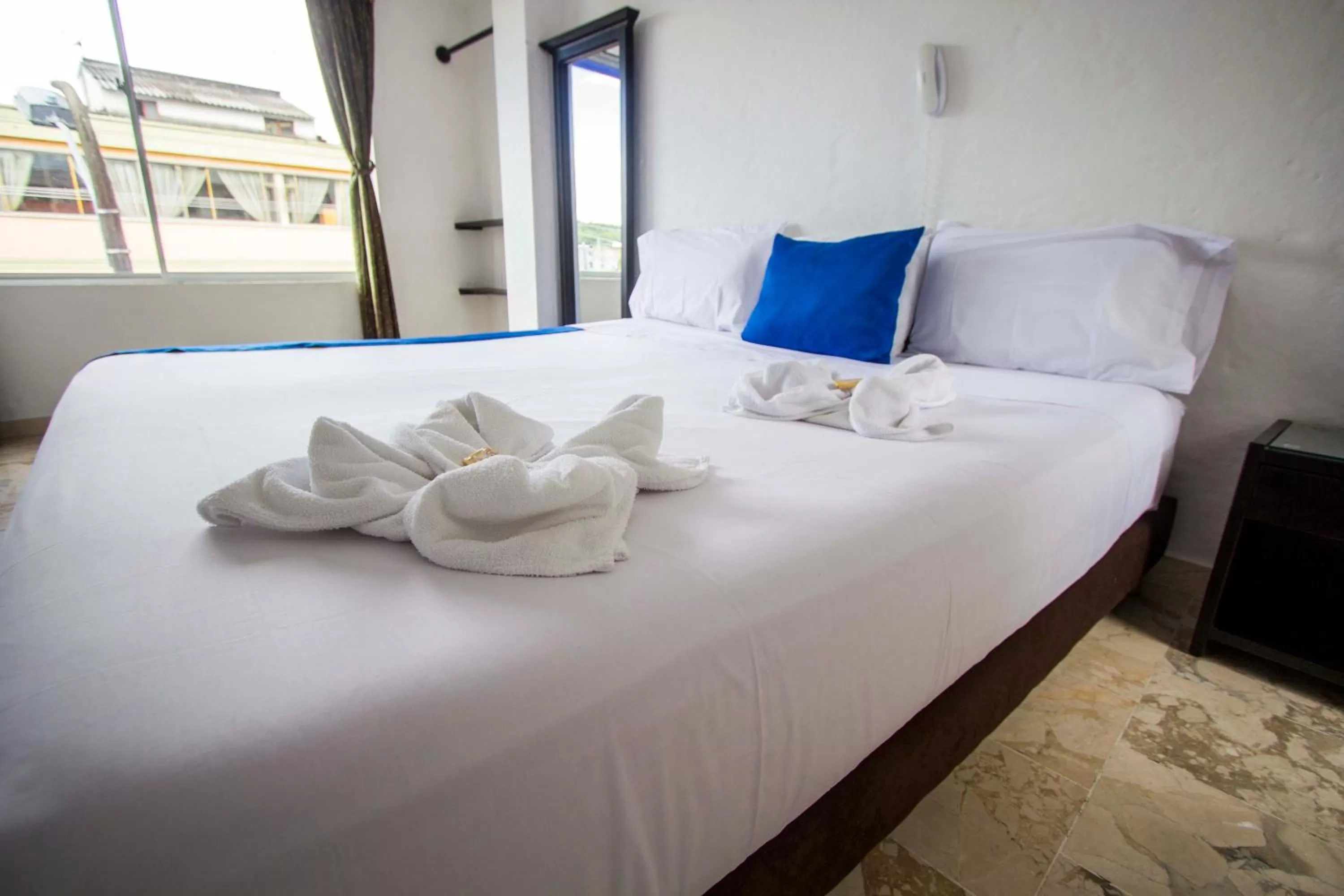 Bed in Blue Star Hotel