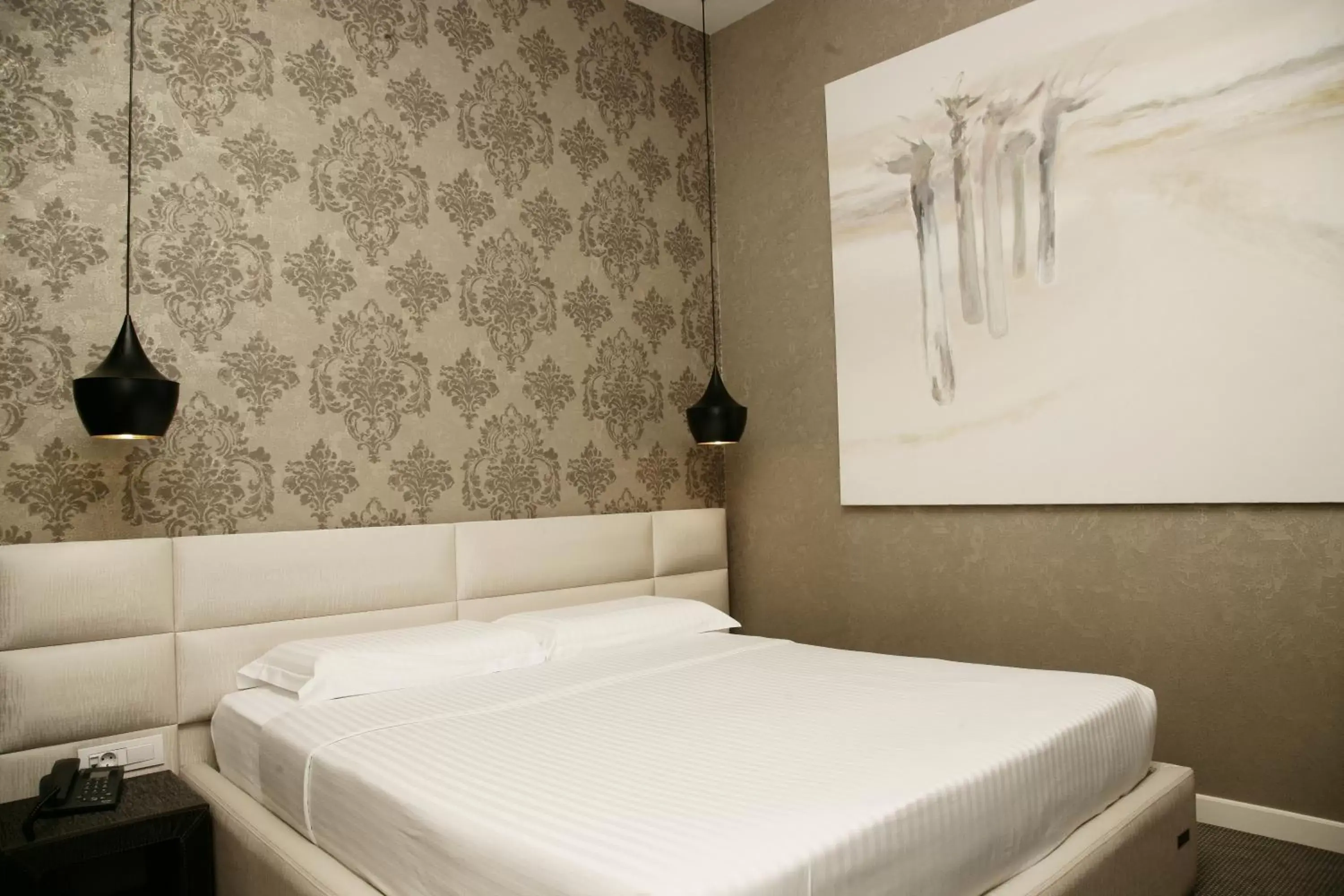 Bed in La Bohème Hotel
