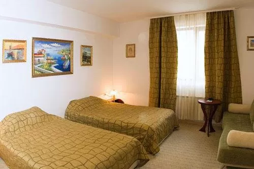 Bed in Family Art Hotel Gallery