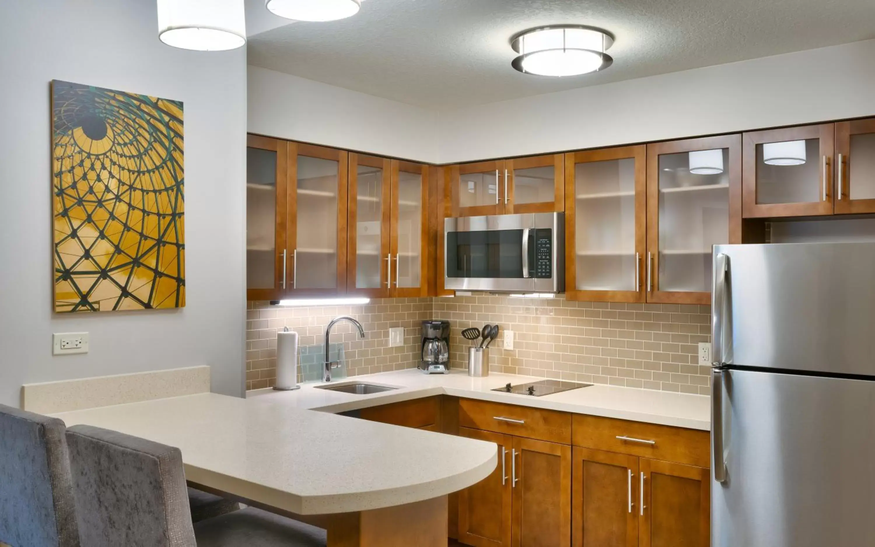 Photo of the whole room, Kitchen/Kitchenette in Staybridge Suites - Gainesville I-75, an IHG Hotel