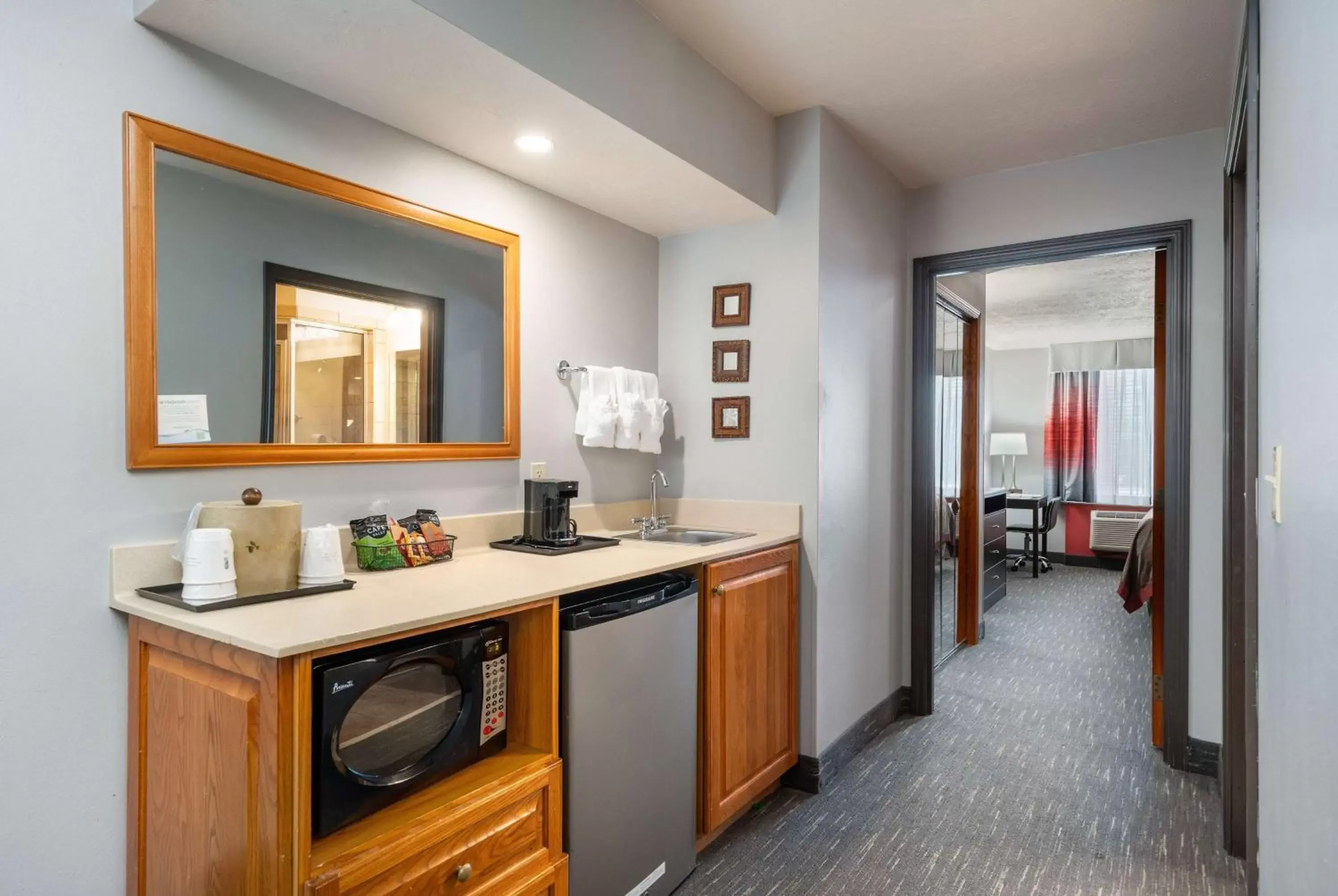 Photo of the whole room, Kitchen/Kitchenette in Ramada by Wyndham Sioux Falls Airport - Waterpark Resort & Event Center