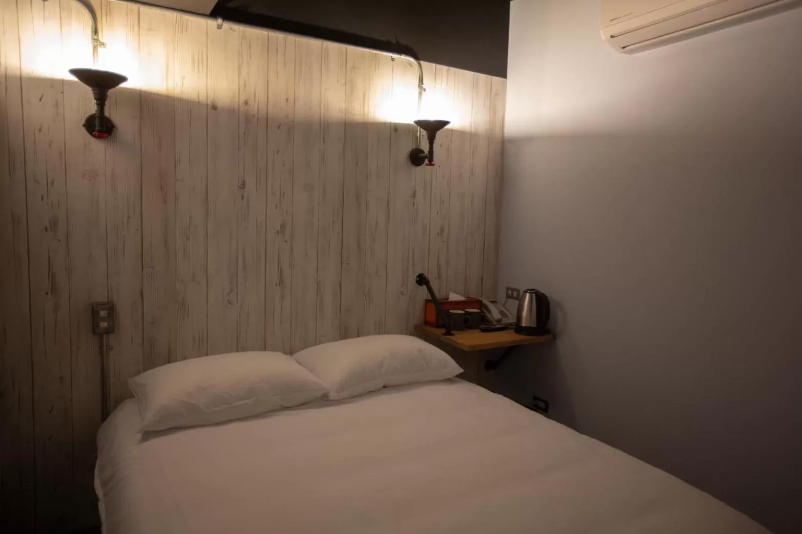 Bed in The Rooms Inn