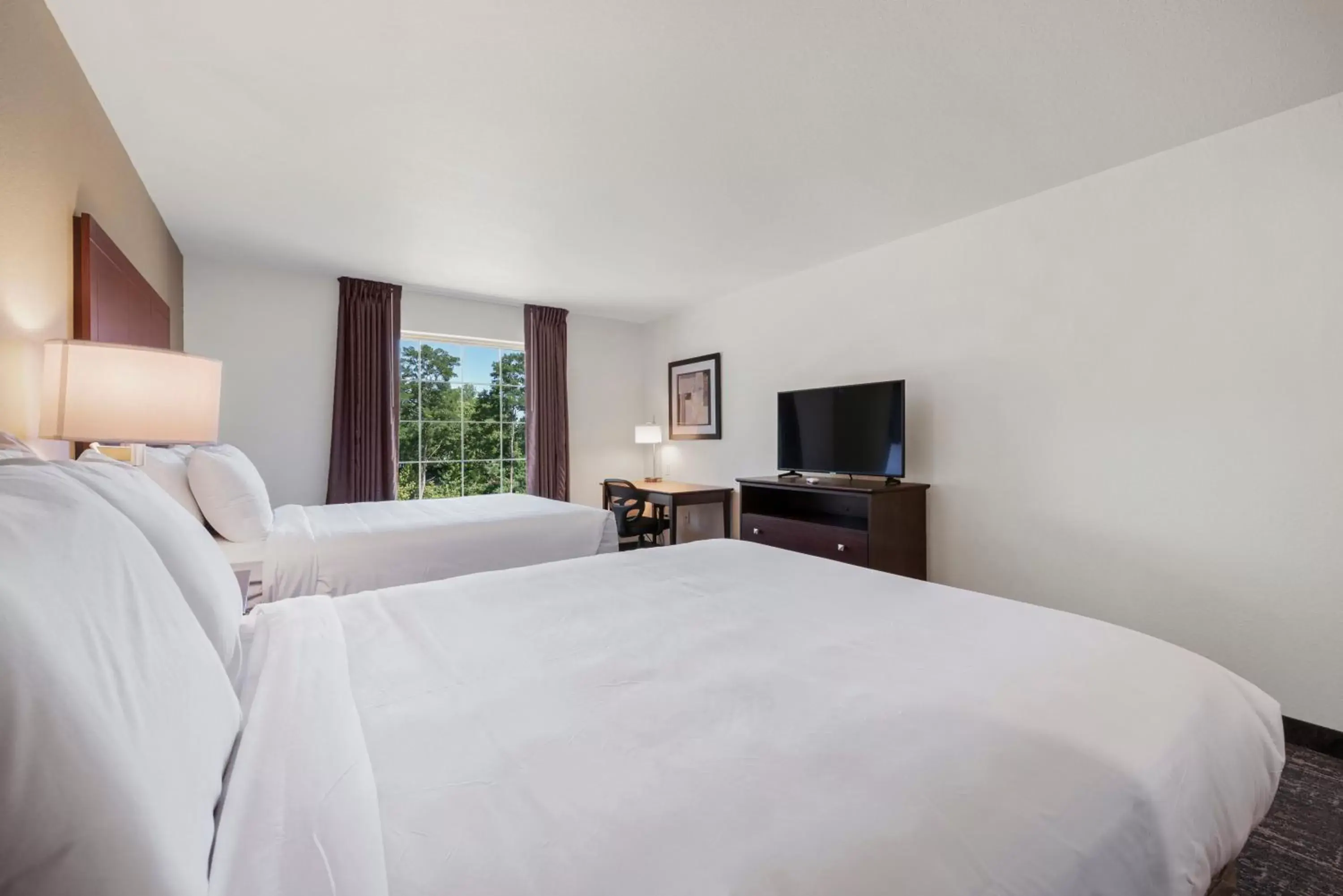 Bed in Cobblestone Hotel & Suites - Urbana